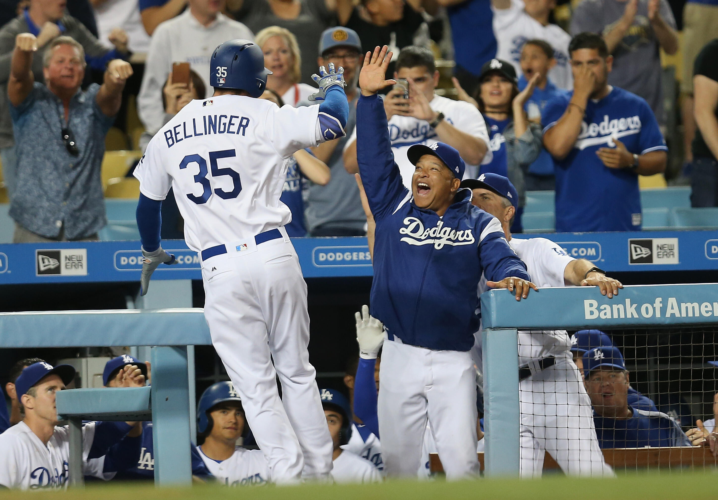 LOS ANGELES, CA - APRIL 29:  Cody Bellinger #35 of the Los Angeles Dodgers is greeted by manager Dave Roberts as he returns to the dugout after hitting a solo home run in the ninth inning against the Philadelphia Phillies at Dodger Stadium on April 29, 20