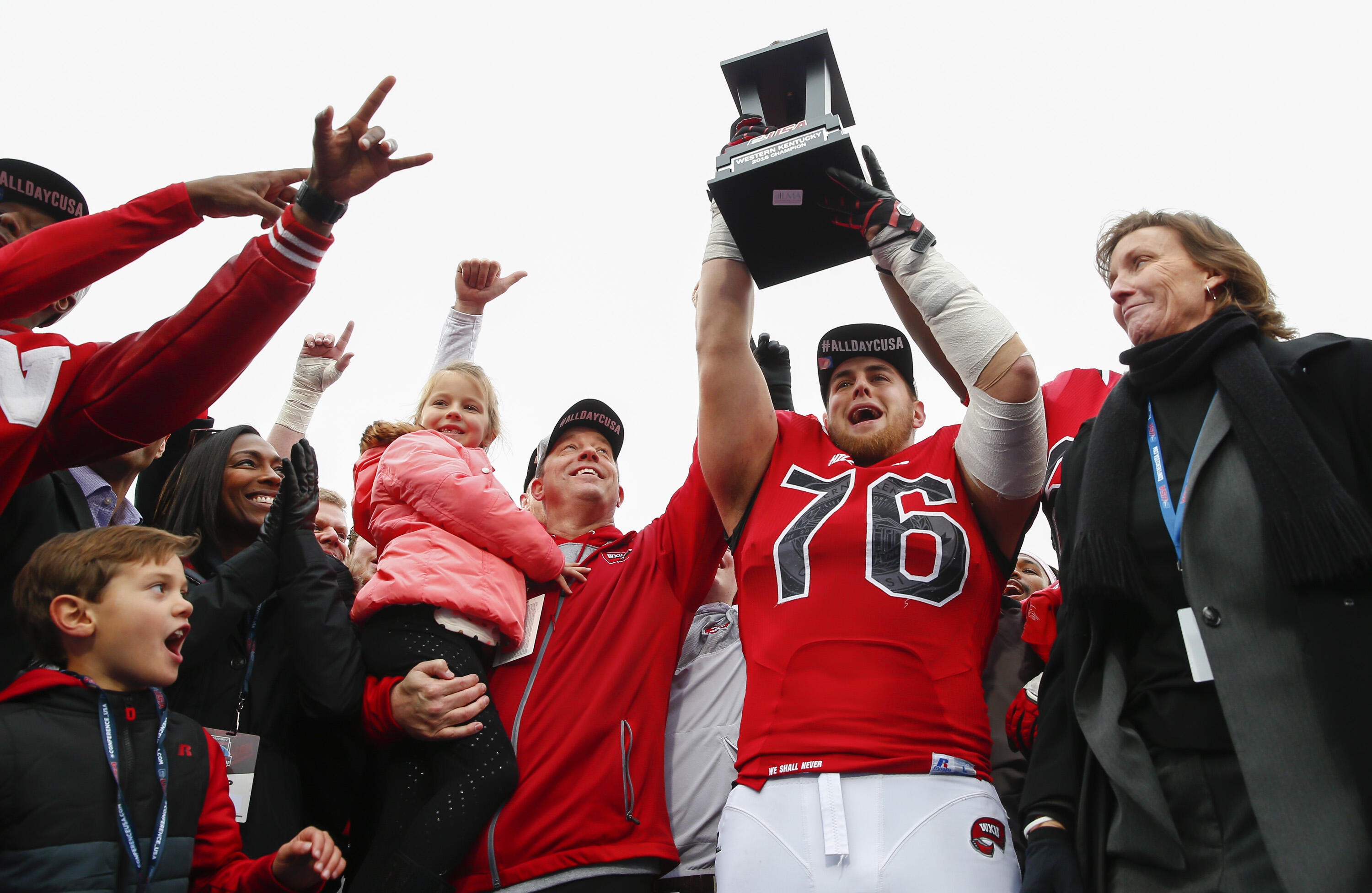 BOWLING GREEN, KY - DECEMBER 03: Head coach Jeff Brohm and Forrest Lamp #76 of the Western Kentucky Hilltoppers celebrate following the game against the Louisiana Tech Bulldogs at Houchens-Smith Stadium on December 3, 2016 in Champaign, Illinois. Western 