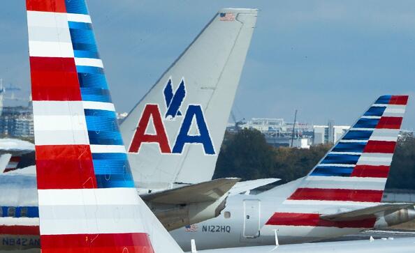 The tails of different versions of American Airlines aircraft are seen on the tarmac November 9, 2016, at Ronald Reagan National Airport in Arlington, Virginia. / AFP / PAUL J. RICHARDS        (Photo credit should read PAUL J. RICHARDS/AFP/Getty Images)