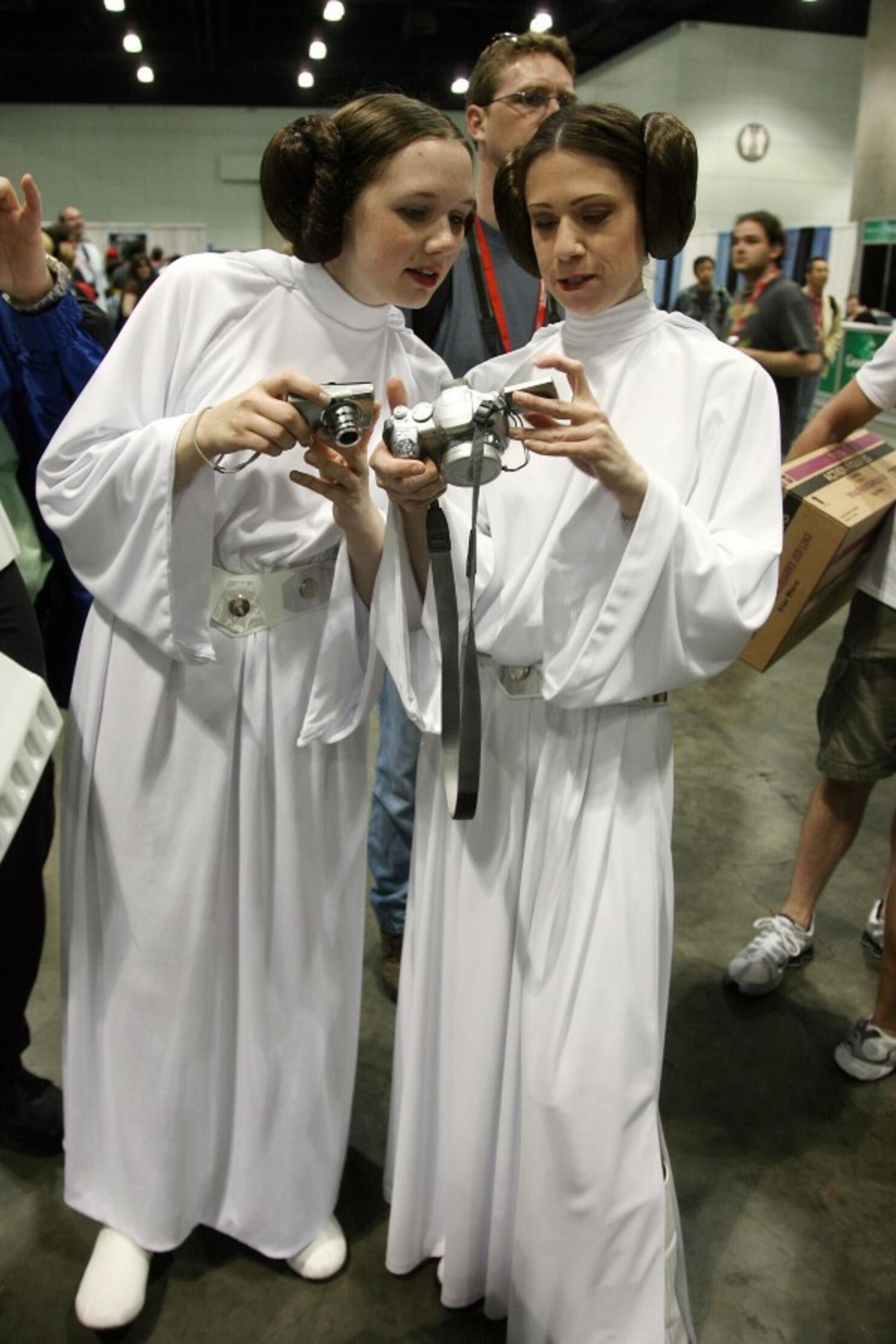 Star Wars fans looks inspect their camer