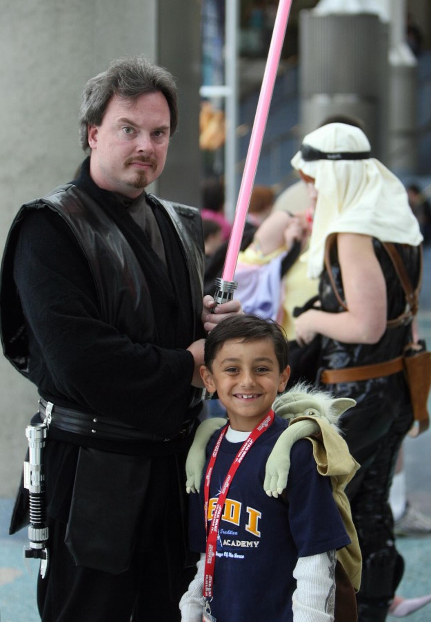 Star Wars fans pose during the opening d