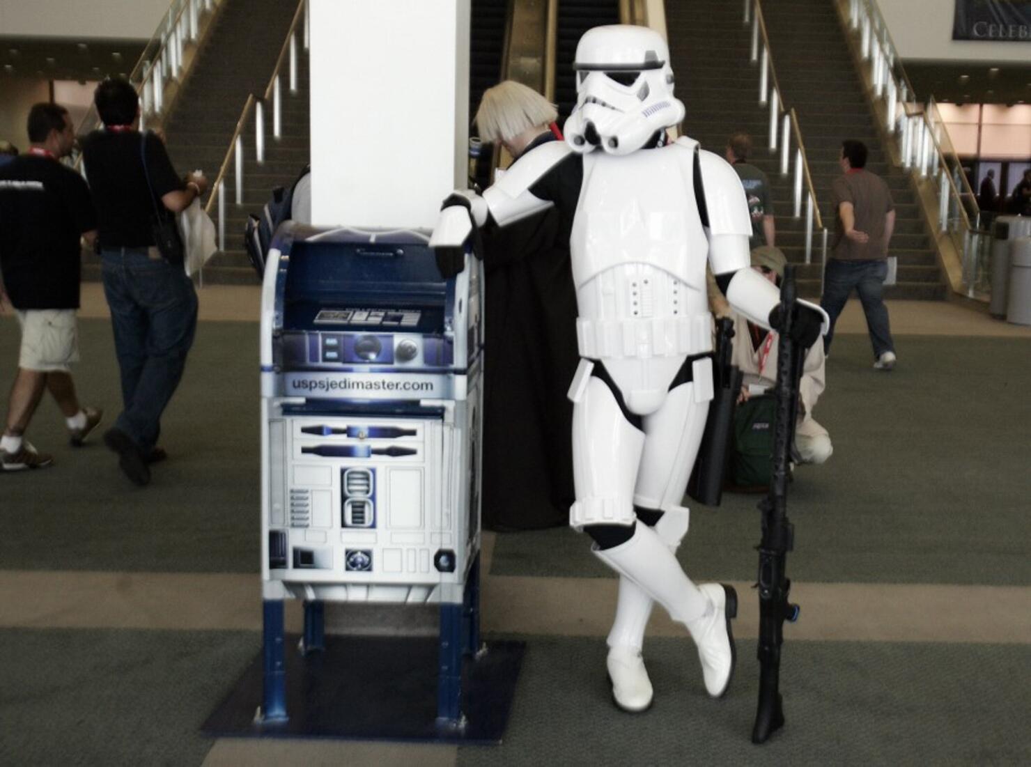Star Wars fan waits close to a mail box