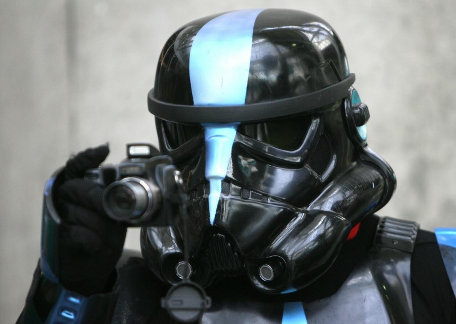 Star Wars fan takes a picture during the