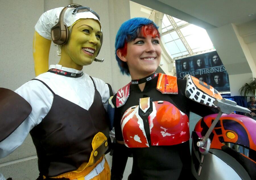 Women play the parts from Star Wars, Hera Syndulla (L) and Sabine Wren during Comic-Con International 2016 in San Diego, California, July 23, 2016. / AFP / Bill Wechter        (Photo credit should read BILL WECHTER/AFP/Getty Images)