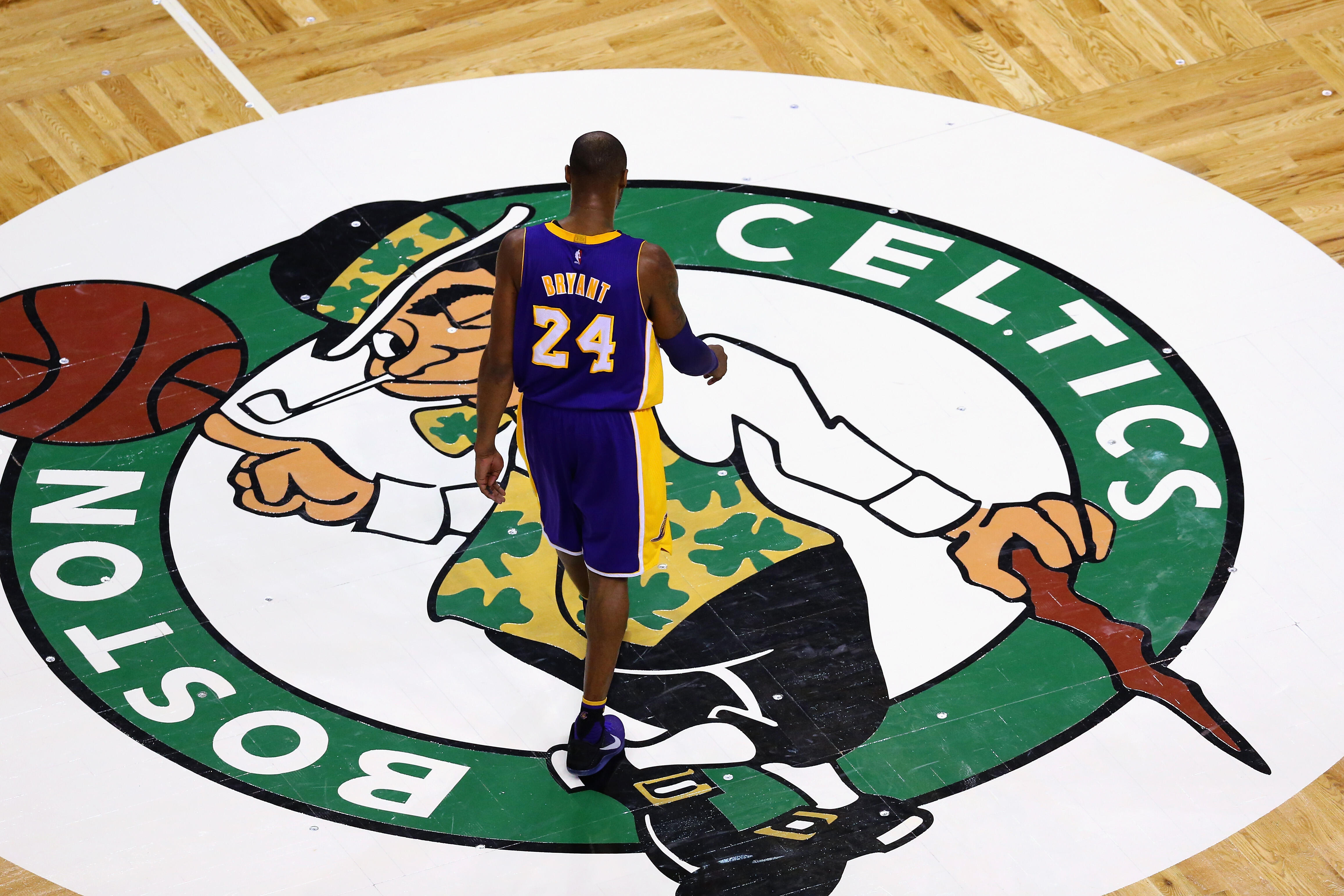 BOSTON, MA - DECEMBER 30:  Kobe Bryant #24 of the Los Angeles Lakers walks towards the bench during a time out against the Boston Celtics  during the fourth quarter at TD Garden on December 30, 2015 in Boston, Massachusetts. The Lakers defeat the Celtics 