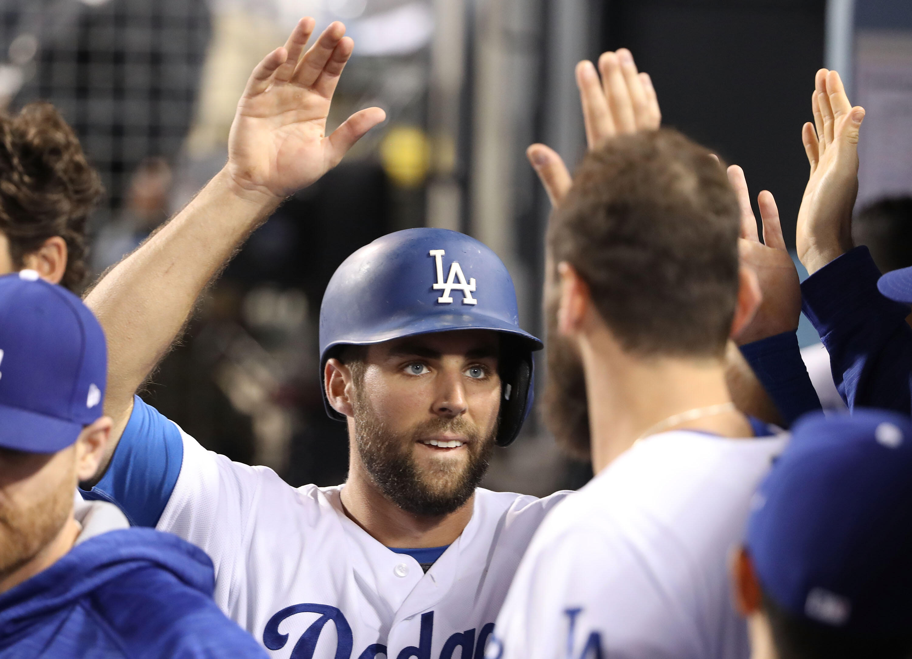 LOS ANGELES, CA - APRIL 19: Chris Taylor #3 of the Los Angeles Dodgers celebrates in the dugout with teammates after scoring during the fifth inning of the MLB game against the Colorado Rockies at Dodger Stadium on April 19, 2017 in Los Angeles, Californi