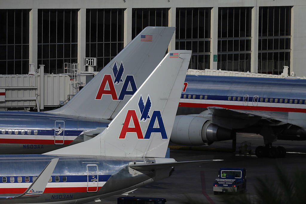 MIAMI, FL - FEBRUARY 13:  American Airlines planes are seen on the tarmac at the Miami International Airport on February 12, 2013 in Miami, Florida. Reports indicate that a deal between American Airlines and US Airways to merge is set to be announced as e