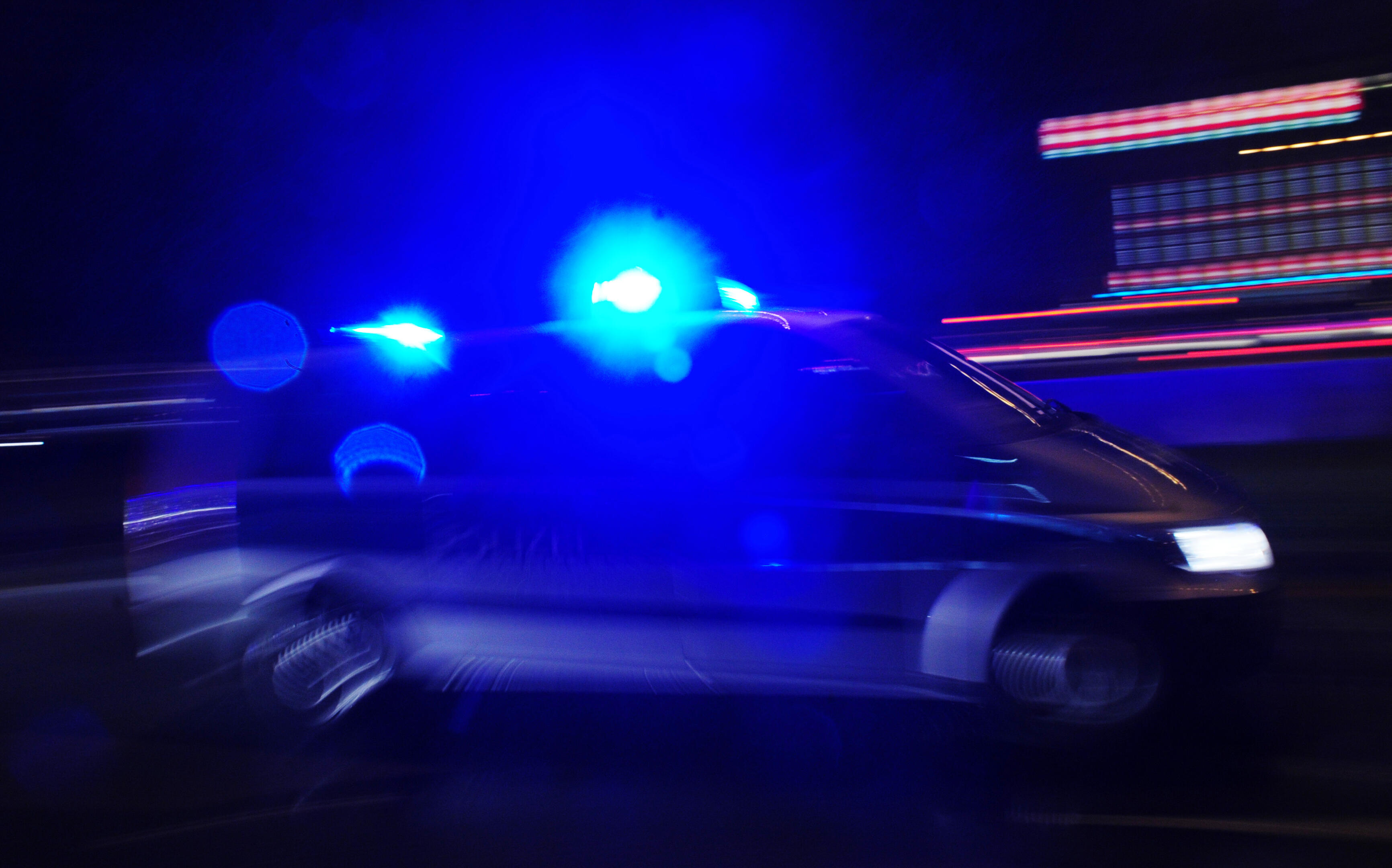 A police car with lights flashing is pictured on October 2, 2010 in Bremen. AFP PHOTO / JOHANNES EISELE (Photo credit should read JOHANNES EISELE/AFP/Getty Images)