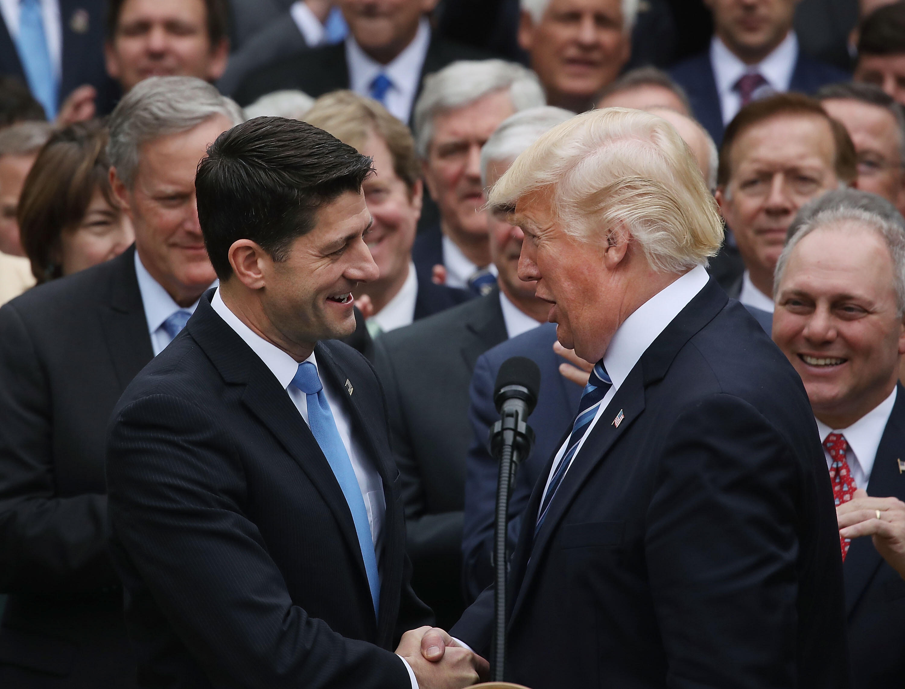 WASHINGTON, DC - MAY 04:  U.S. President Donald Trump (R) congratulates House Speaker Paul Ryan (R-WI) after Republicans passed legislation aimed at repealing and replacing ObamaCare, during an event in the Rose Garden at the White House, on May 4, 2017 i