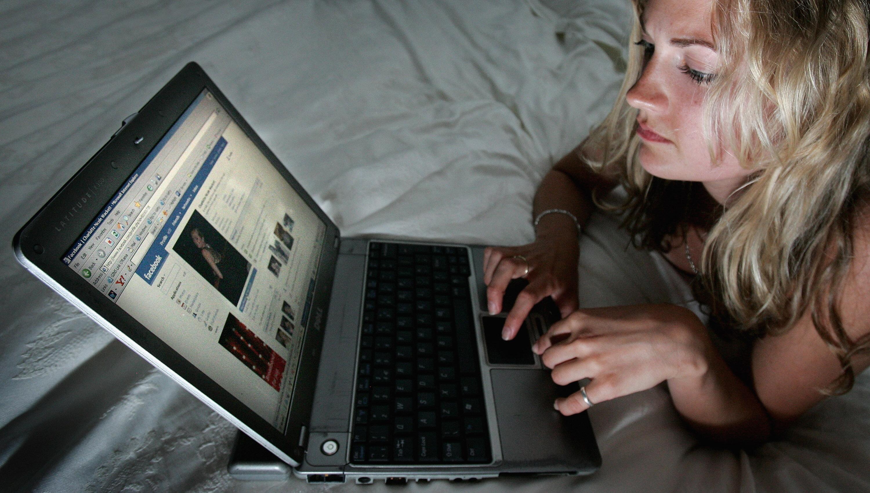 LONDON - JULY 10:  In this photo illustration a girl browses the social networking site Facebook on July 10, 2007 in London, England. Facebook has been rapidly catching up on MySpace as the premier social networking website and as of July 2007 was the sec