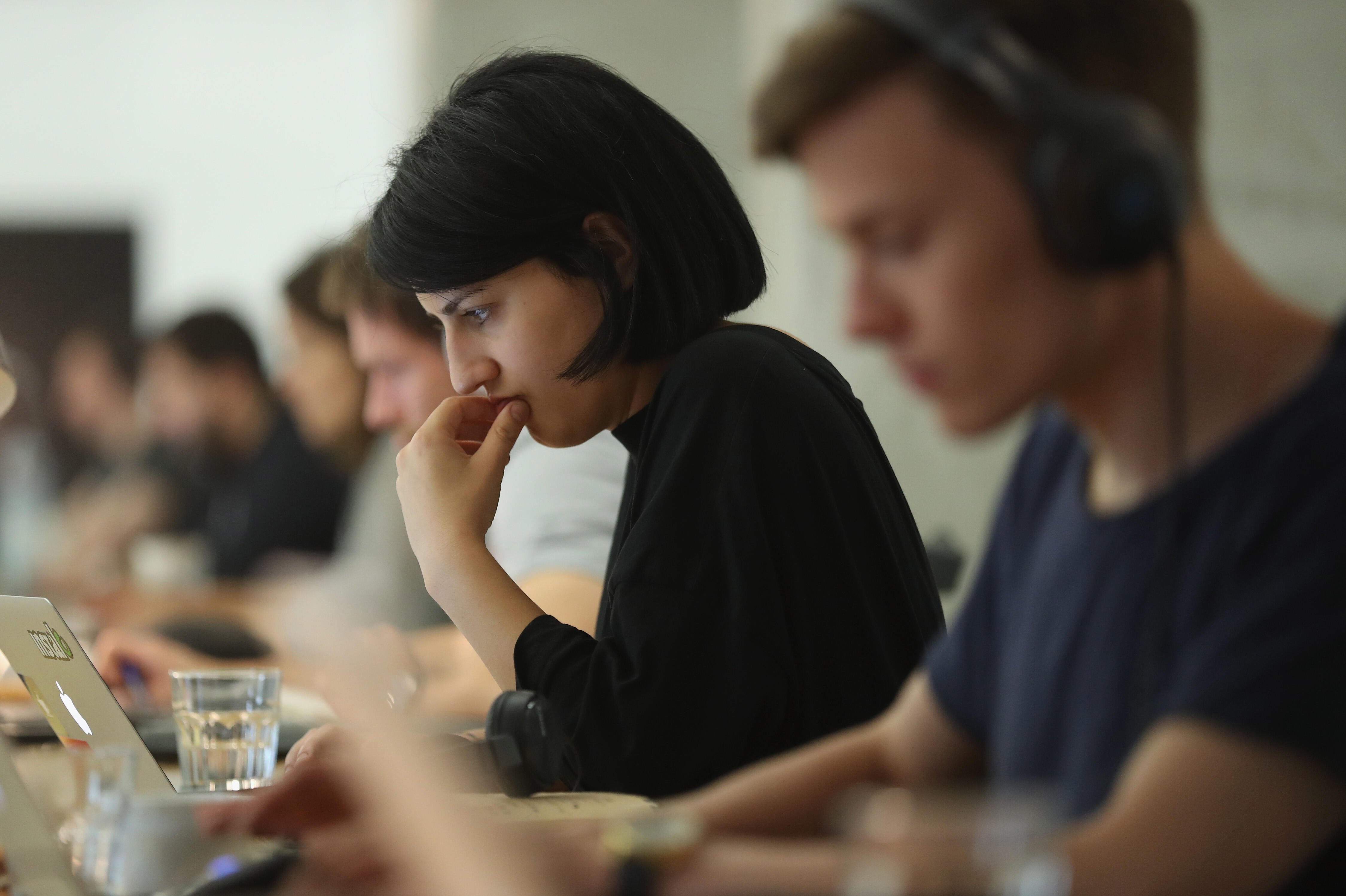 BERLIN, GERMANY - JULY 14:  People work at computers in the community space of Factory Berlin on July 14, 2016 in Berlin, Germany. Factory Berlin is a commercial space that has sought to attract tech companies and startups and so far has rented out office