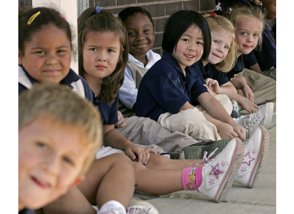 Children sit during a break at Northwest