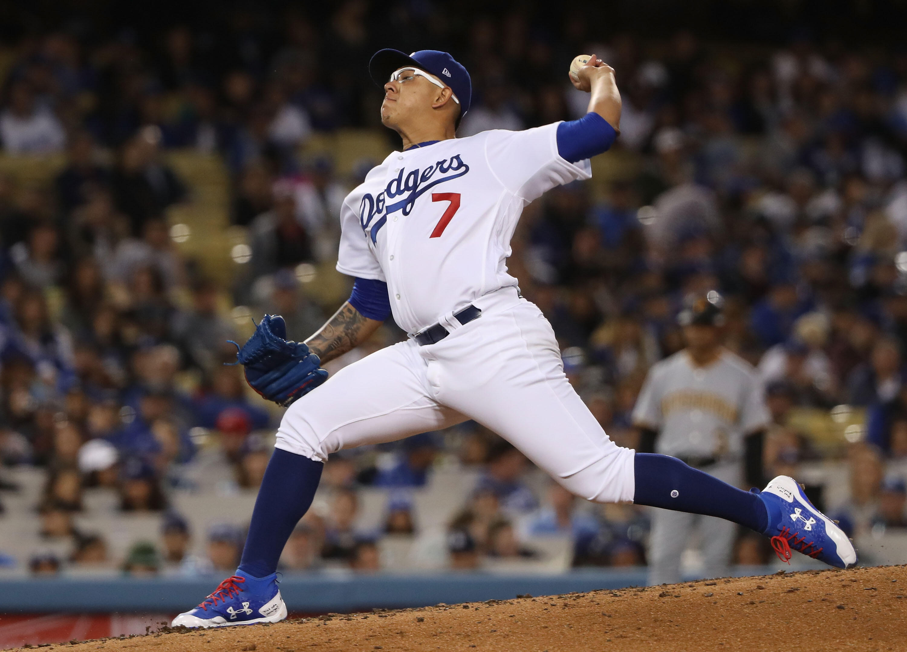 LOS ANGELES, CA - MAY 09: Pitcher Julio Urias #7 of the Los Angeles Dodgers pitches in the third inning during the MLB game against the Pittsburgh Pirates at Dodger Stadium on May 9, 2017 in Los Angeles, California.  (Photo by Victor Decolongon/Getty Imag