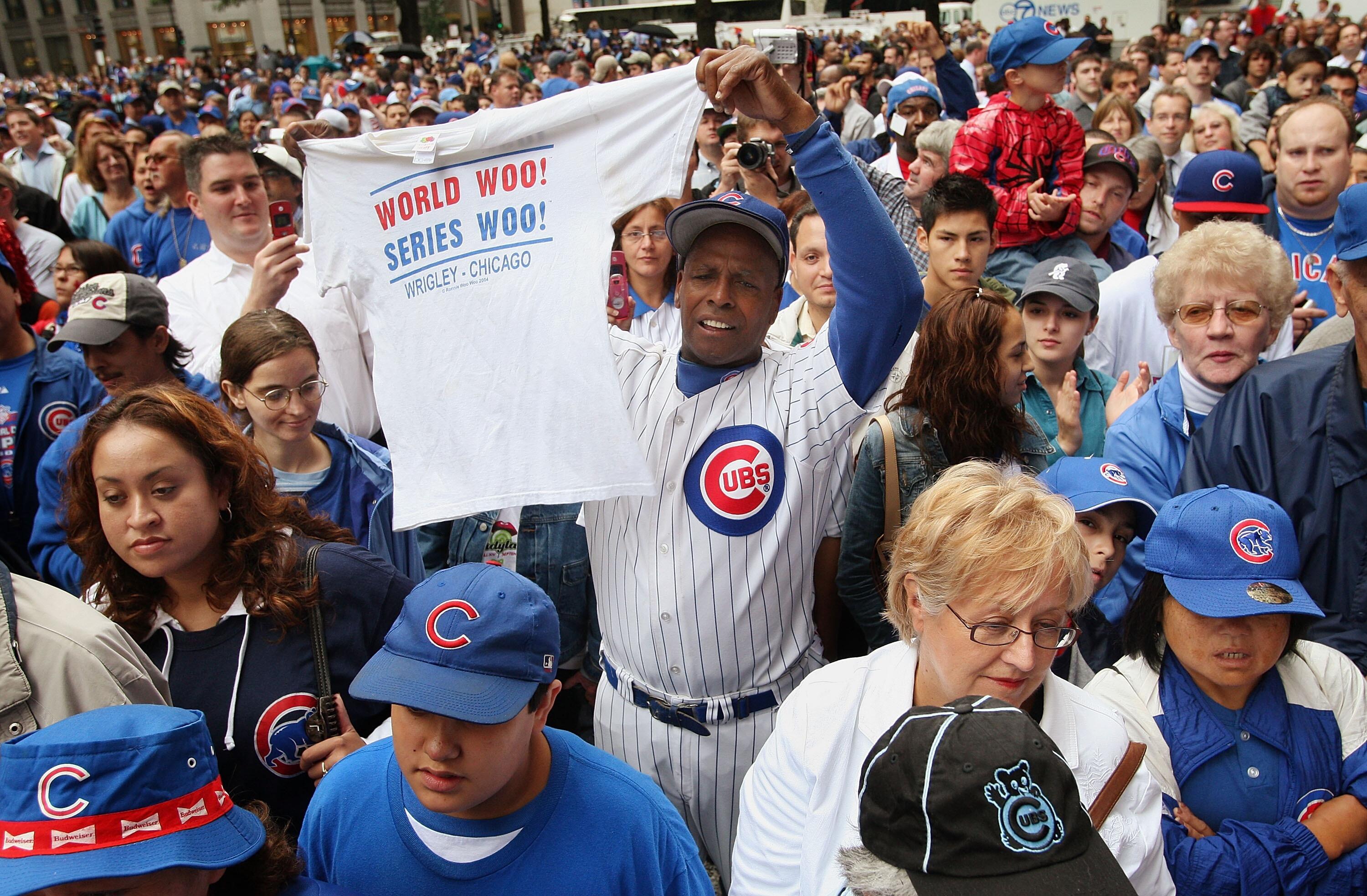 CHICAGO - OCTOBER 01:  One of the Chicago Cubs' most famous fans Ronnie Woo-Woo Wickers (C) celebrates the team making it into the playoffs with other fans at a lunch-time rally downtown October 1, 2007 in Chicago, Illinois. This is the first time the Cub