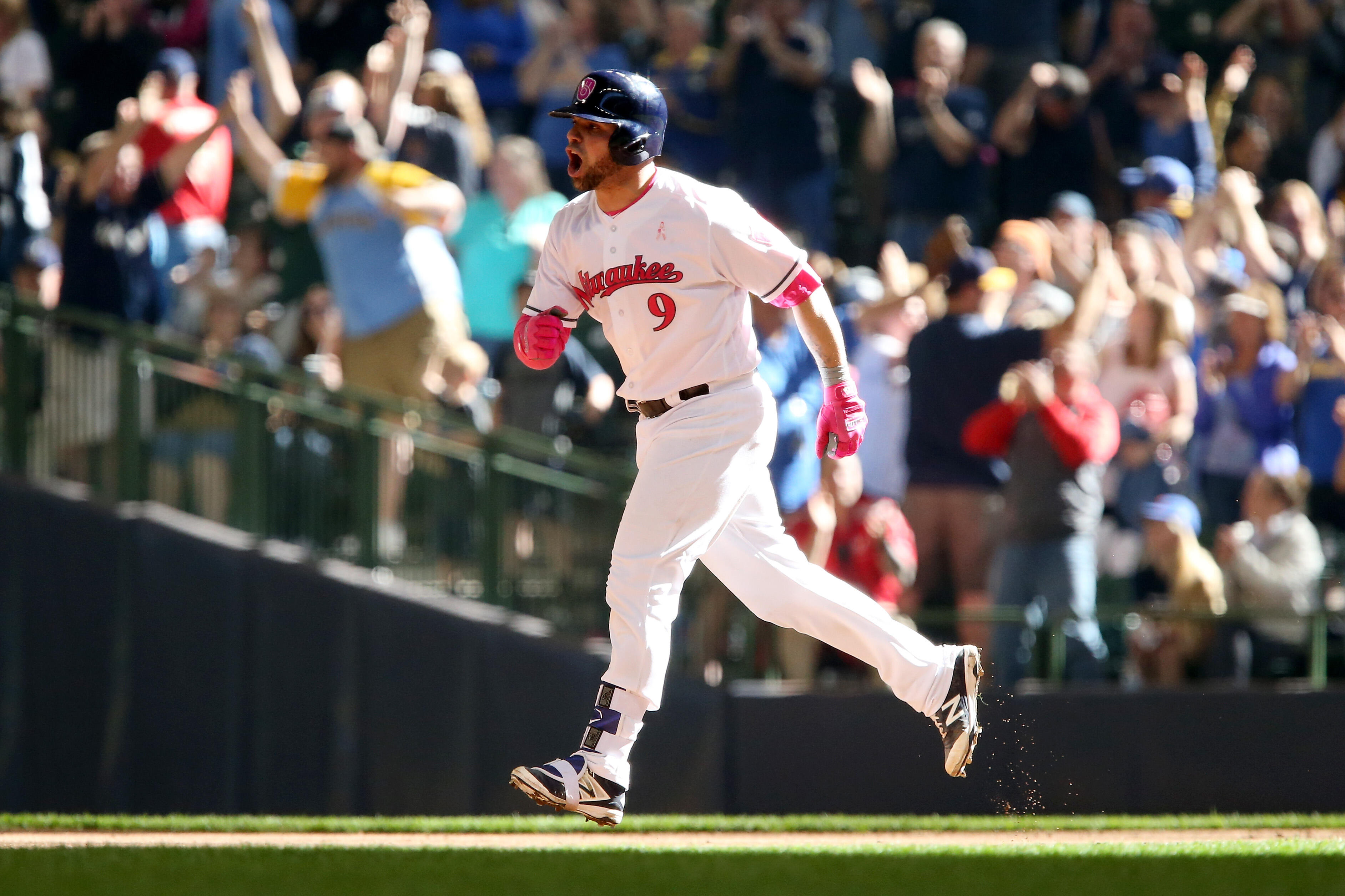 MILWAUKEE, WI - MAY 14:  Manny Pina #9 of the Milwaukee Brewers reacts after hitting a home run in the eighth inning against the New York Mets at Miller Park on May 14, 2017 in Milwaukee, Wisconsin. Players are wearing pink to celebrate Mother's Day weeke