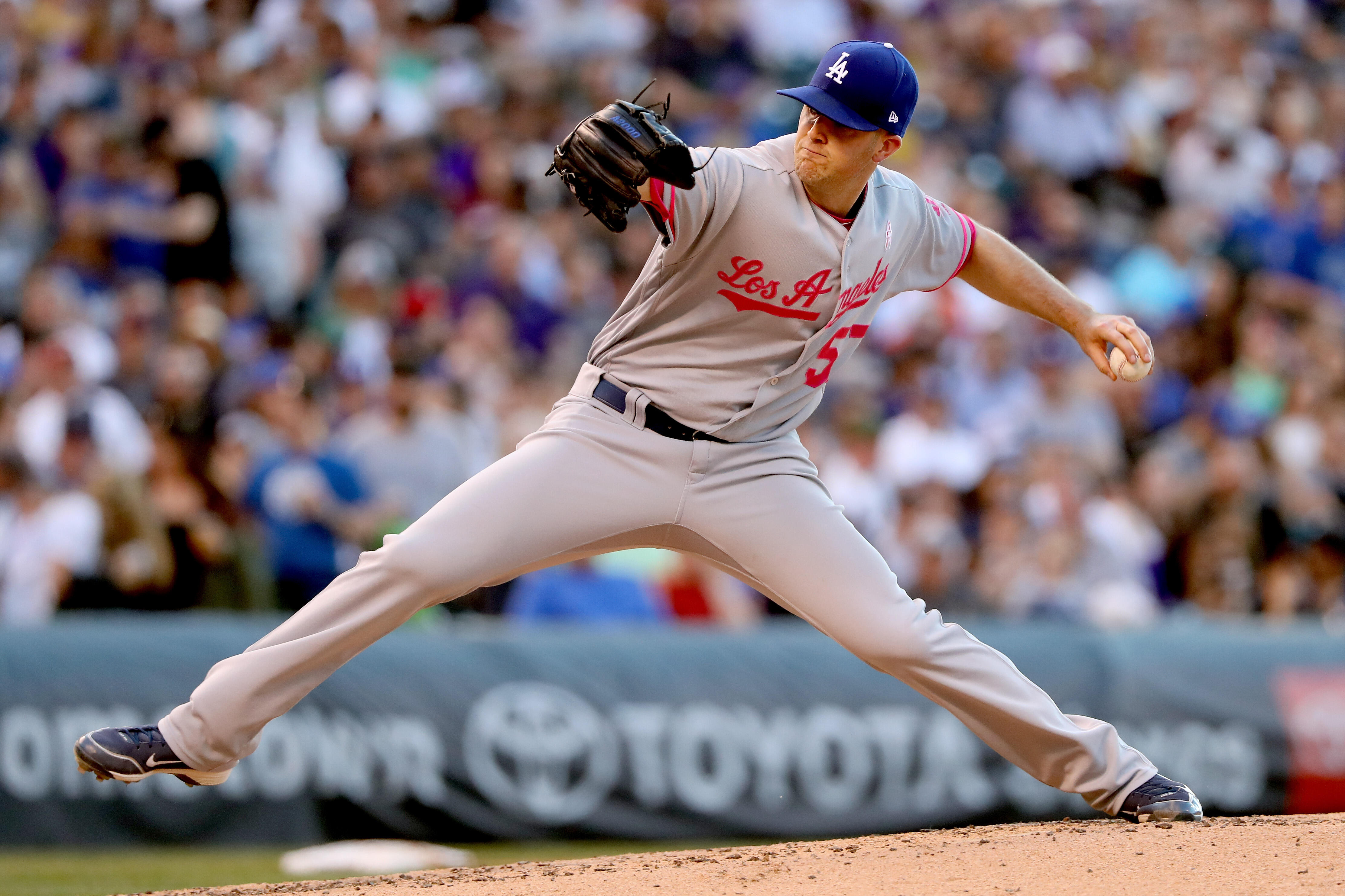 DENVER, CO - MAY 13:  Starting pitcher Alex Wood #57 of the Los Angeles Dodgers throws in the third inning against the Colorado Rockies at Coors Field on May 13, 2017 in Denver, Colorado. Members of both teams were wearing pink in commemoration of Mother'