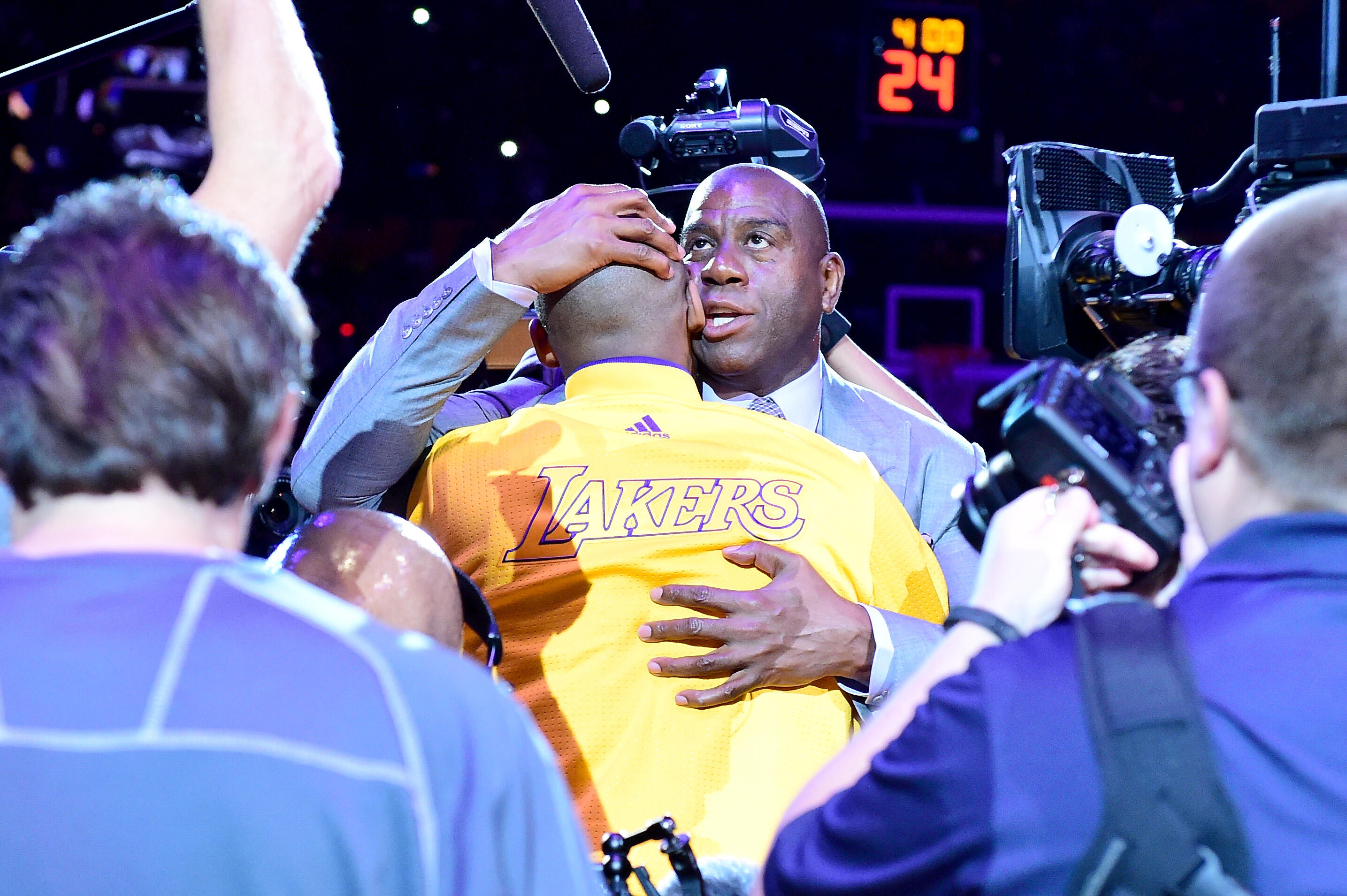 LOS ANGELES, CA - APRIL 13:  Earvin 'Magic' Johnson hugs Kobe Bryant #24 of the Los Angeles Lakers before the game against the Utah Jazz at Staples Center on April 13, 2016 in Los Angeles, California. NOTE TO USER: User expressly acknowledges and agrees t