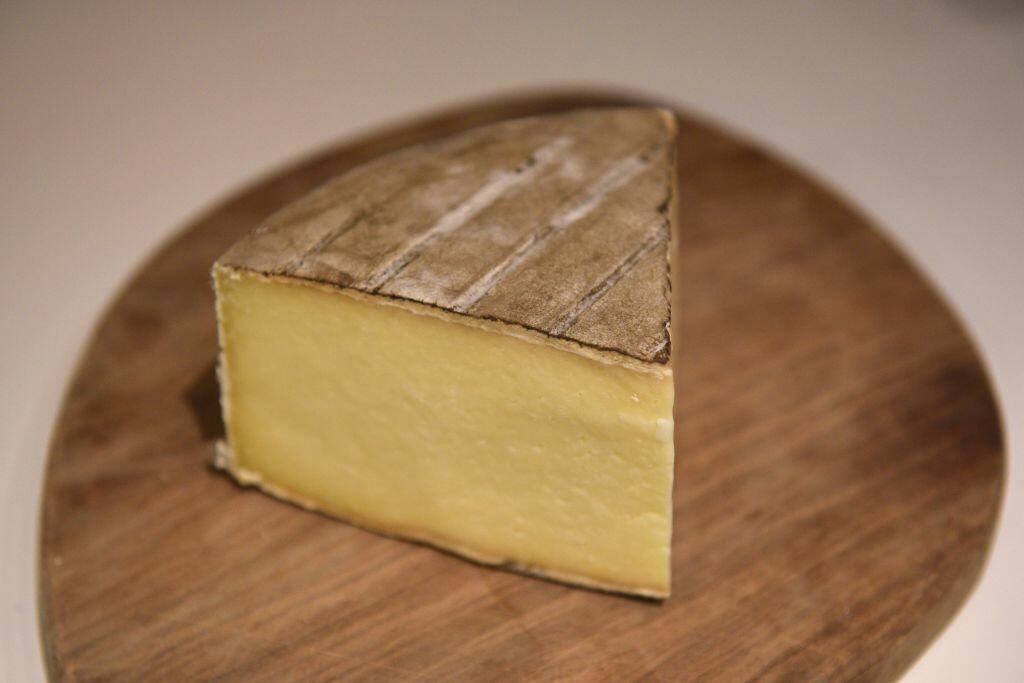 A piece of Single Gloucester, a full-fat hard cheese made with Old Gloucester cows milk, which was produced on Charles Martell and Sons Ltd's farm, is seen displayed for sale in a delicatessen in Ledbury, south west England on February 9, 2017. In 1994 Single Gloucester cheese was awarded the  European Union's Protected Designation of Origin (PDO) status which demands that it can only be made on Gloucestershire farms, using a specific recipe with milk from Old Gloucester cows. Britain's impending EU exit puts the status of this British delicacy at risk. / AFP PHOTO / OLI SCARFF / TO GO WITH AFP STORY BY ROSIE SCAMMELL        (Photo credit should read OLI SCARFF/AFP/Getty Images)