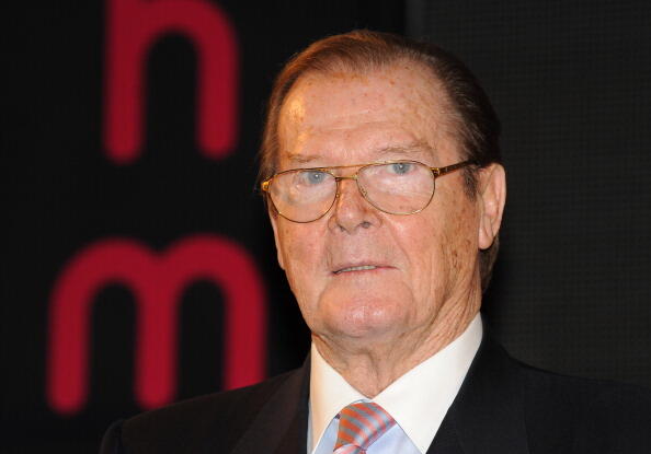 LONDON, UNITED KINGDOM - OCTOBER 22: Sir Roger Moore meets fans and signs copies of his book 'Bond on Bond' at HMV, Oxford Street on October 22, 2012 in London, England. (Photo by Stuart Wilson/Getty Images)