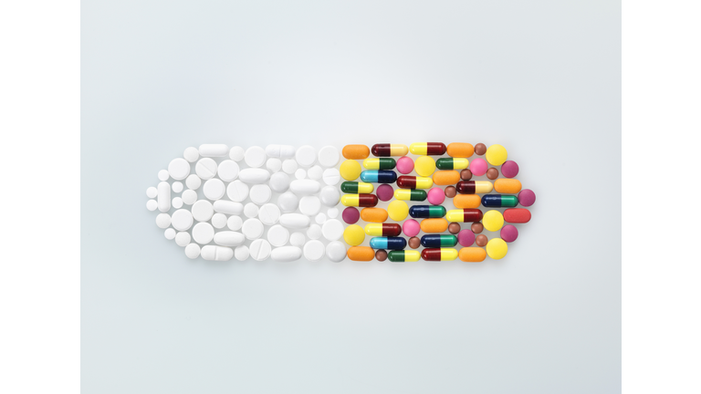 Assorted medical pills and tablets in shape of drug capsule