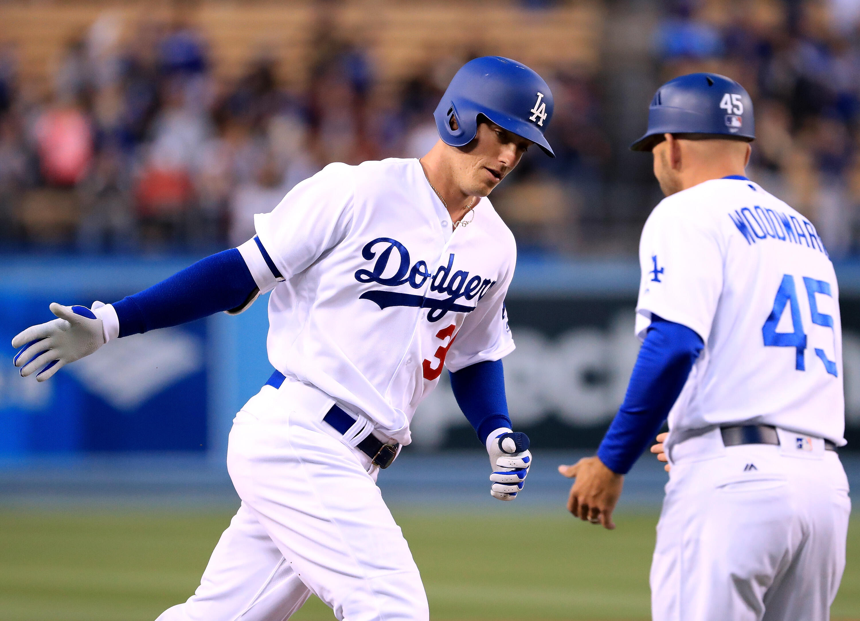 LOS ANGELES, CA - MAY 10:  Cody Bellinger #35 of the Los Angeles Dodgers celebrates his two run homerun for a 2-0 lead with third base coach Chris Woodward #45 during the first inning against the Pittsburgh Pirates at Dodger Stadium on May 10, 2017 in Los