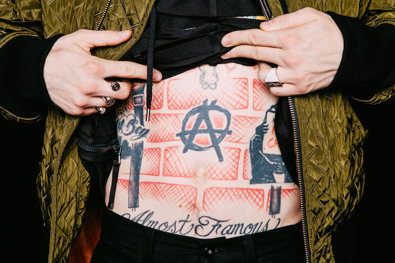 mgk stomach tattoos