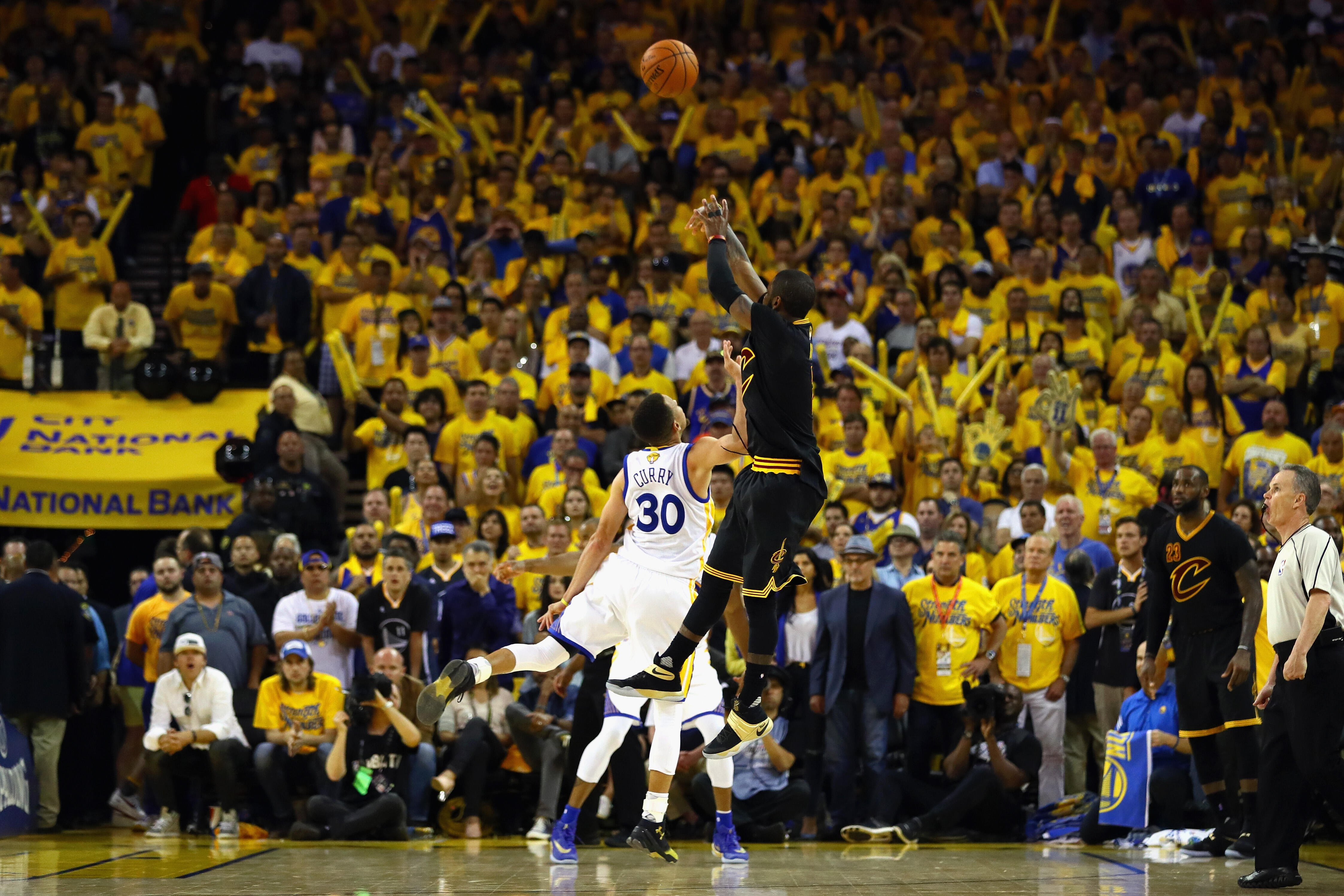 OAKLAND, CA - JUNE 19:  Kyrie Irving #2 of the Cleveland Cavaliers shoots a three-point basket late in the fourth quarter against Stephen Curry #30 of the Golden State Warriors in Game 7 of the 2016 NBA Finals at ORACLE Arena on June 19, 2016 in Oakland, 