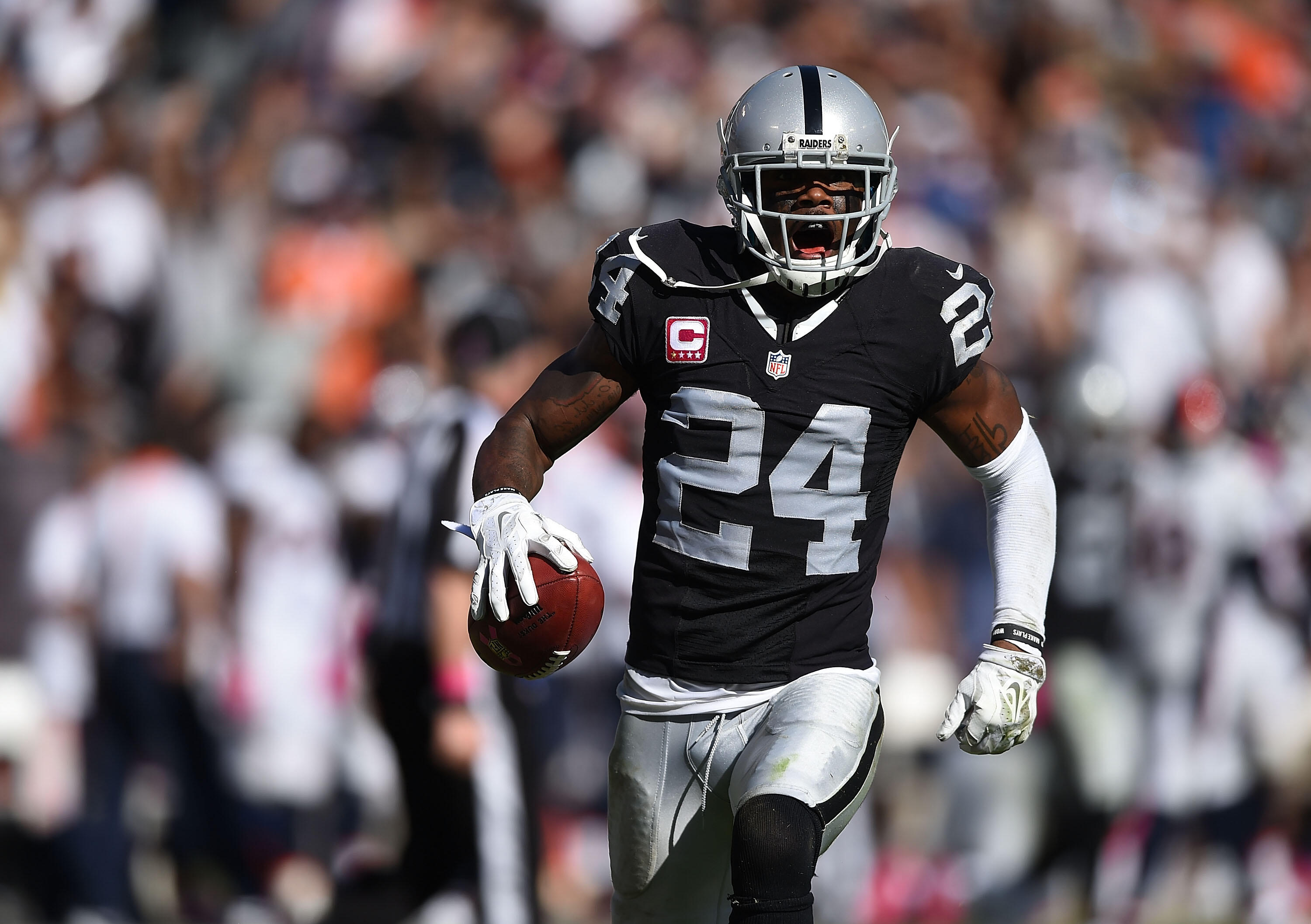 OAKLAND, CA - OCTOBER 11:  Charles Woodson #24 of the Oakland Raiders celebrates an interception against the Denver Broncos in the third quarter at O.co Coliseum on October 11, 2015 in Oakland, California.  (Photo by Thearon W. Henderson/Getty Images)