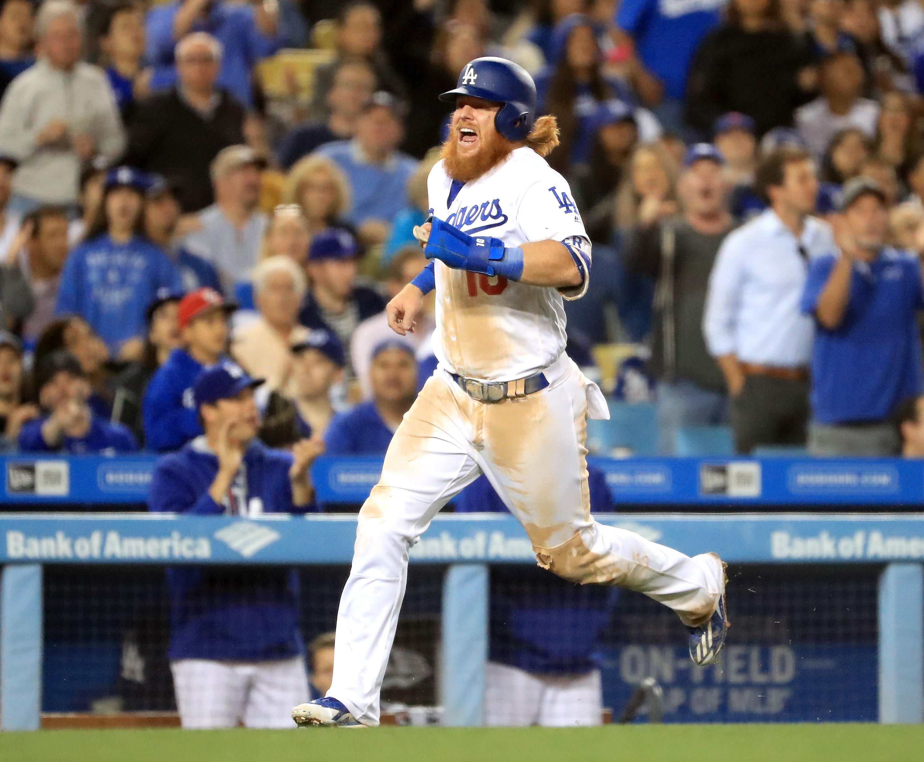 LOS ANGELES, CA - MAY 18:  Justin Turner #10 of the Los Angeles Dodgers sustains an injury as he attempts to score from third base during the seventh inning against the Miami Marlins at Dodger Stadium on May 18, 2017 in Los Angeles, California.  (Photo by