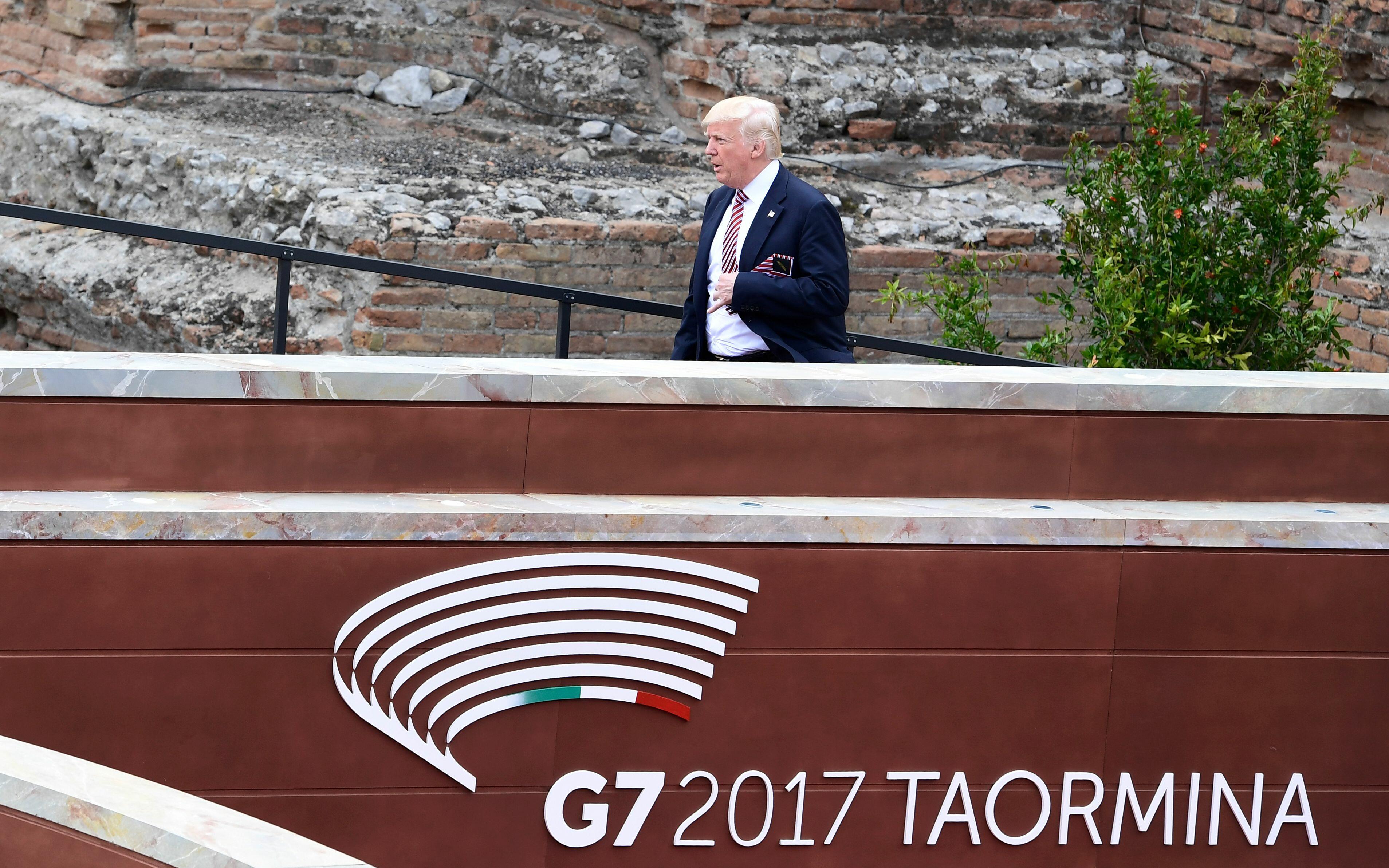 US President Donald Trump arrives for the Summit of the Heads of State and of Government of the G7, the group of most industrialized economies, plus the European Union, on May 26, 2017 at the ancient Greek Theater in Taormina, Sicily. The leaders of Brita