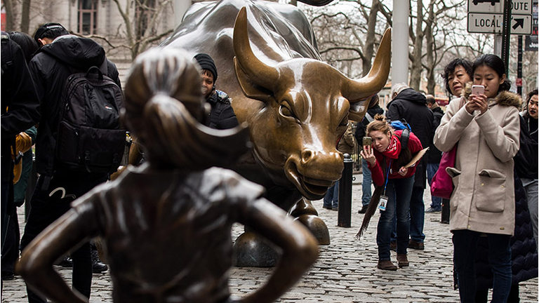 Statue Of Defiant Girl Installed In Front Of Iconic Wall Street Bull By Global Investment Firm