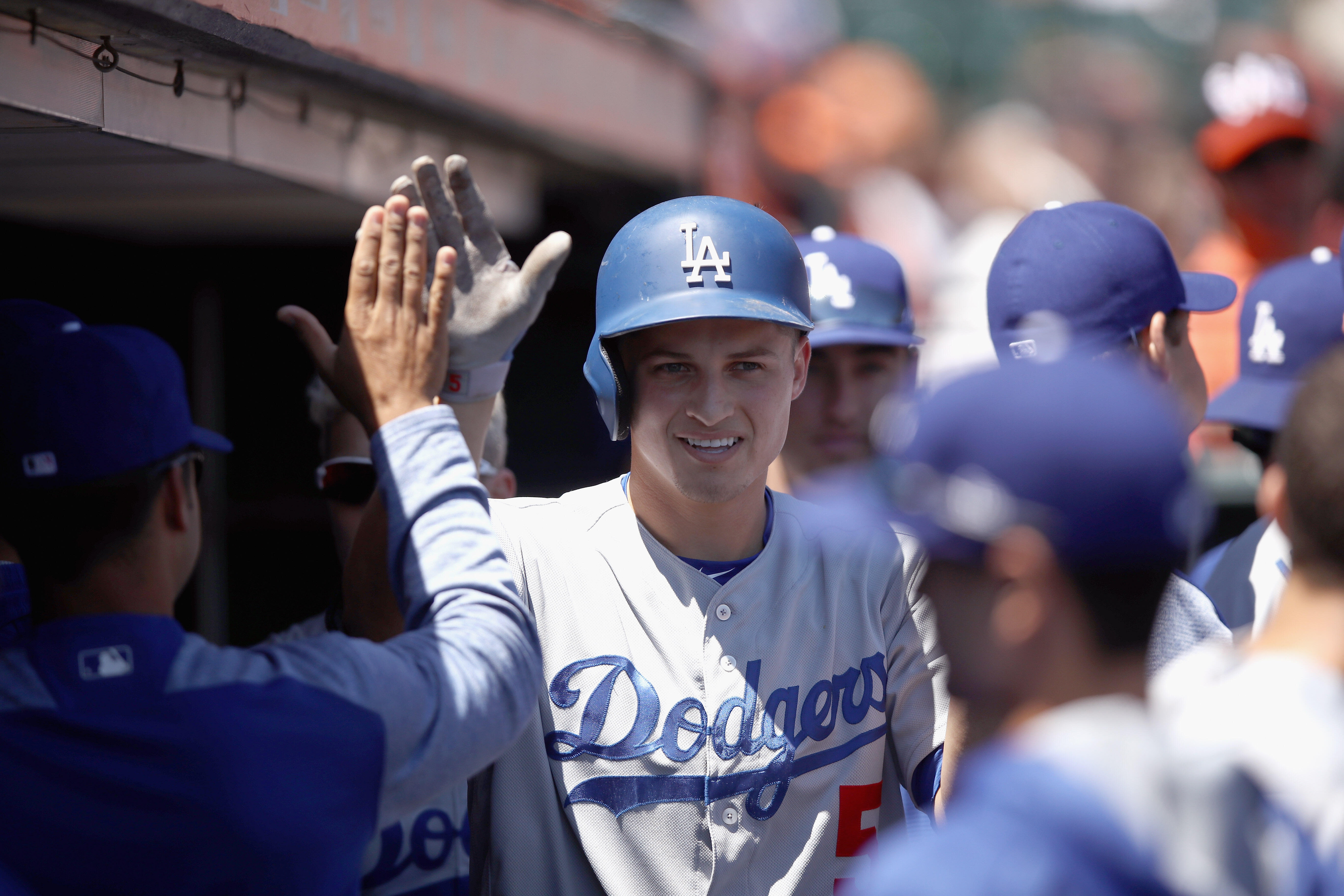 SAN FRANCISCO, CA - APRIL 27:  Corey Seager #5 of the Los Angeles Dodgers is congratulated by teammates after hitting a home run in the first inning against the San Francisco Giants at AT&T Park on April 27, 2017 in San Francisco, California.  (Photo by E