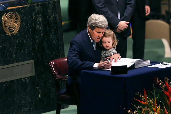 NEW YORK, NY - APRIL 22:  U.S. Secretary of State John Kerry holds his two year-old grand daughter Isabel Dobbs-Higginson for the signing of the accord at the United Nations Signing Ceremony for the Paris Agreement  climate change accord that came out of negotiations at the COP21 climate summit last December in Paris. on April 22, 2016 in New York City. At least 155 countries are expected to sign the agreement which has the goal of limiting warming to 