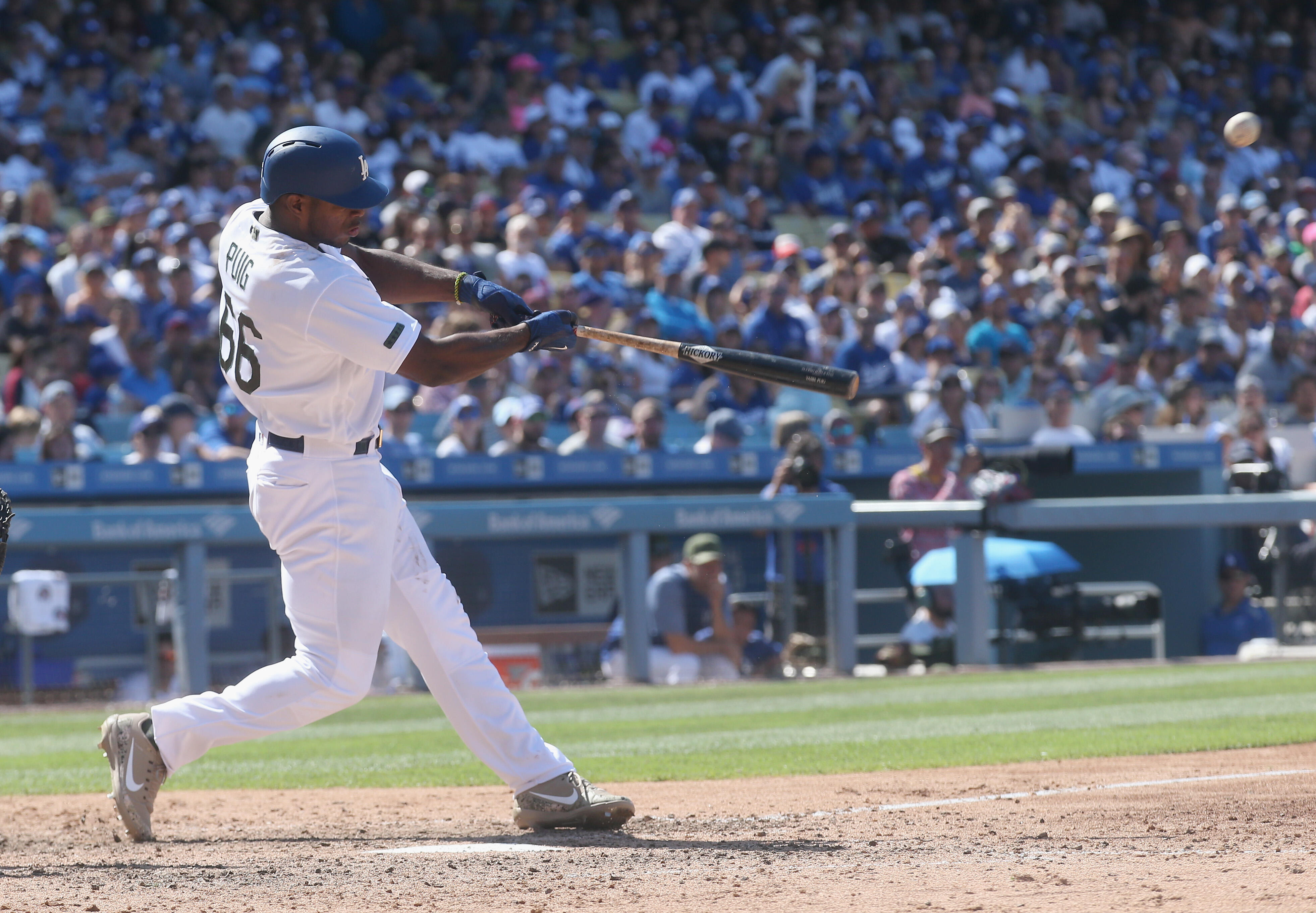 LOS ANGELES, CA - MAY 28:  Yasiel Puig #66 of the Los Angeles Dodgers hits a two run home run in the seventh inning against the Chicago Cubs at Dodger Stadium on May 28, 2017 in Los Angeles, California.  The Dodgers won 9-4.  (Photo by Stephen Dunn/Getty 