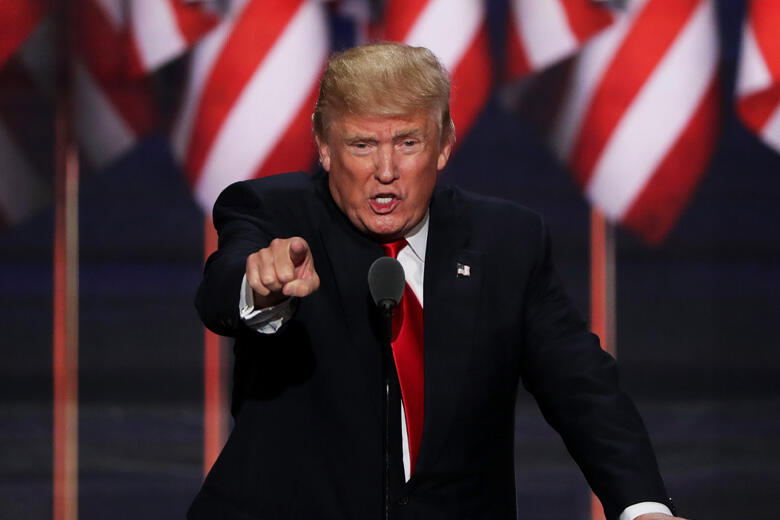 CLEVELAND, OH - JULY 21:  Republican presidential candidate Donald Trump points to the crowd as he delivers a speech during the evening session on the fourth day of the Republican National Convention on July 21, 2016 at the Quicken Loans Arena in Clevelan