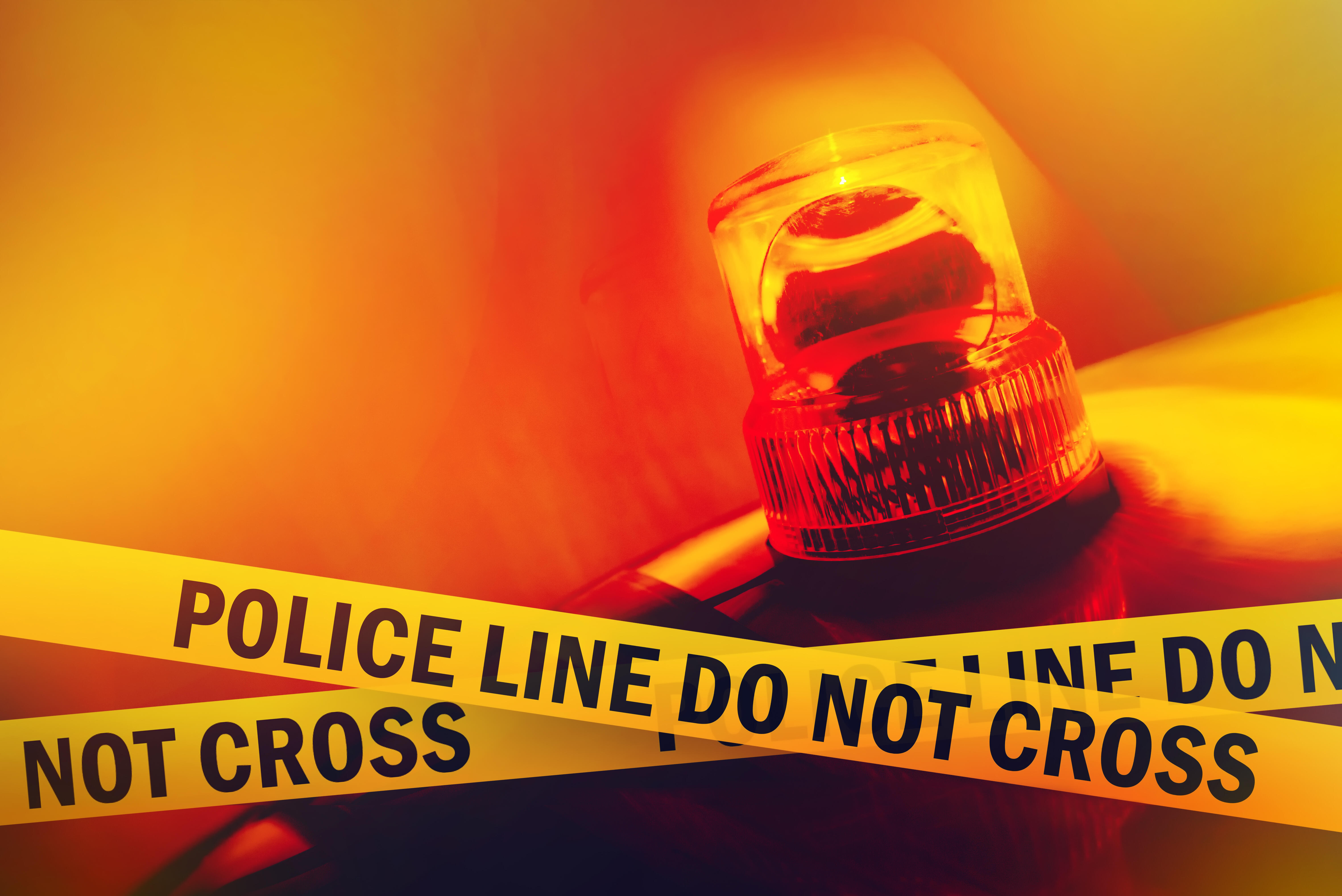 Police Line Do Not Cross Yellow Headband Tape and Orange flashing and revolving light. Murder Scene Police Ribbon.