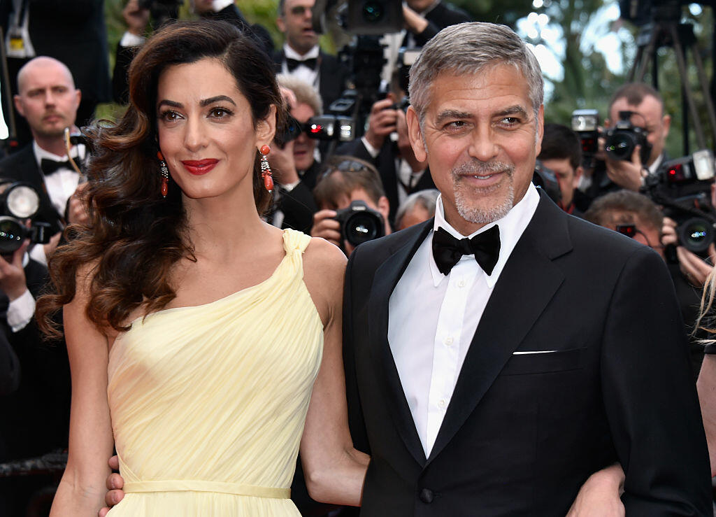 CANNES, FRANCE - MAY 12:  Lawyer Amal Clooney (L) and actor George Clooney attend a screening of 