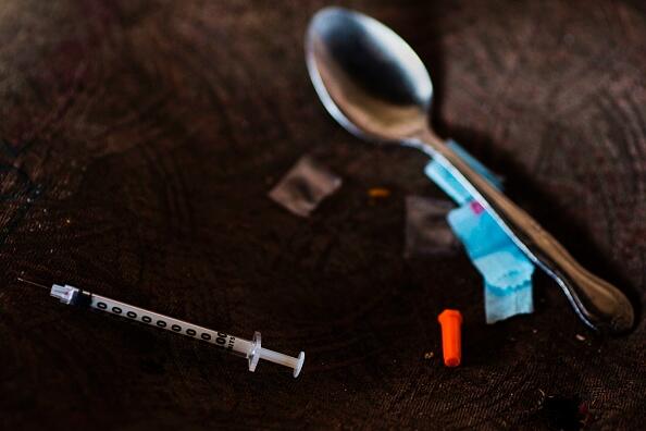 A needle, spoon, and narcotics bag are seen near a heroin encampment in the Kensington neighborhood of Philadelphia, Pennsylvania, on April 10, 2017.   In North Philadelphia, railroad gulch as it is knowen, is ground zero in Philadelphia?s opioid epidemic. Known by locals as El Campanento, the open air drug market and heroin encampment is built with the discarded materials from the gulch and populated by addicts seeking a hit of heroin to keep their dope sick, or withdrawal symptoms, at bay. In one area, near the 2nd Avenue overpass, empty syringe wrappers blanket the refuse like grass  the used needles they once contained poking through like thistles. According to the city Health Commission, Philadelphia is on track to see 33 percent more drug overdose deaths in 2017 over last year.    / AFP PHOTO / DOMINICK REUTER        (Photo credit should read DOMINICK REUTER/AFP/Getty Images)