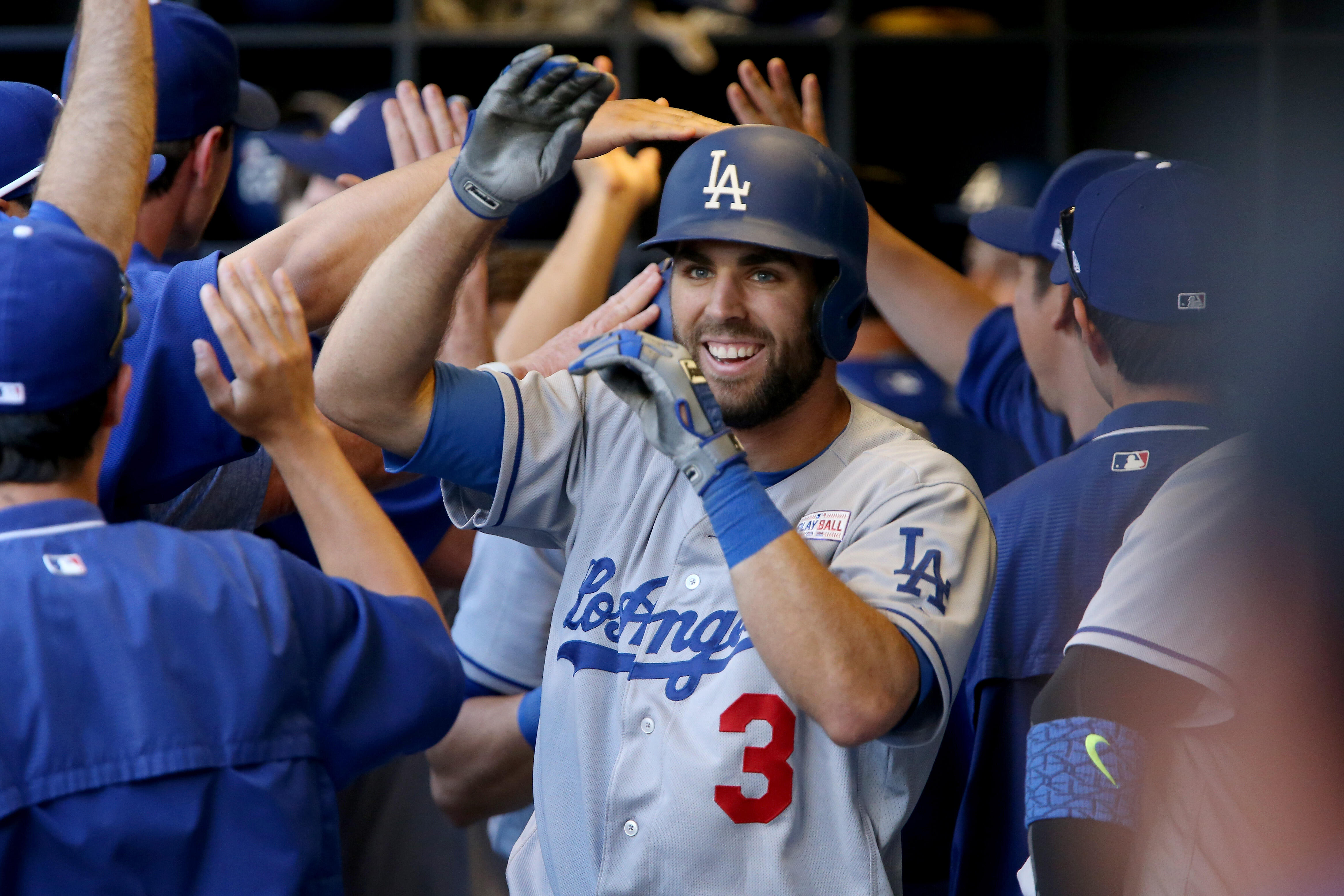 MILWAUKEE, WI - JUNE 3:  Chris Taylor #3 of the Los Angeles Dodgers celebrates with teammates after hitting a grand slam in the ninth inning against the Milwaukee Brewers at Miller Park on June 3, 2017 in Milwaukee, Wisconsin. (Photo by Dylan Buell/Getty 