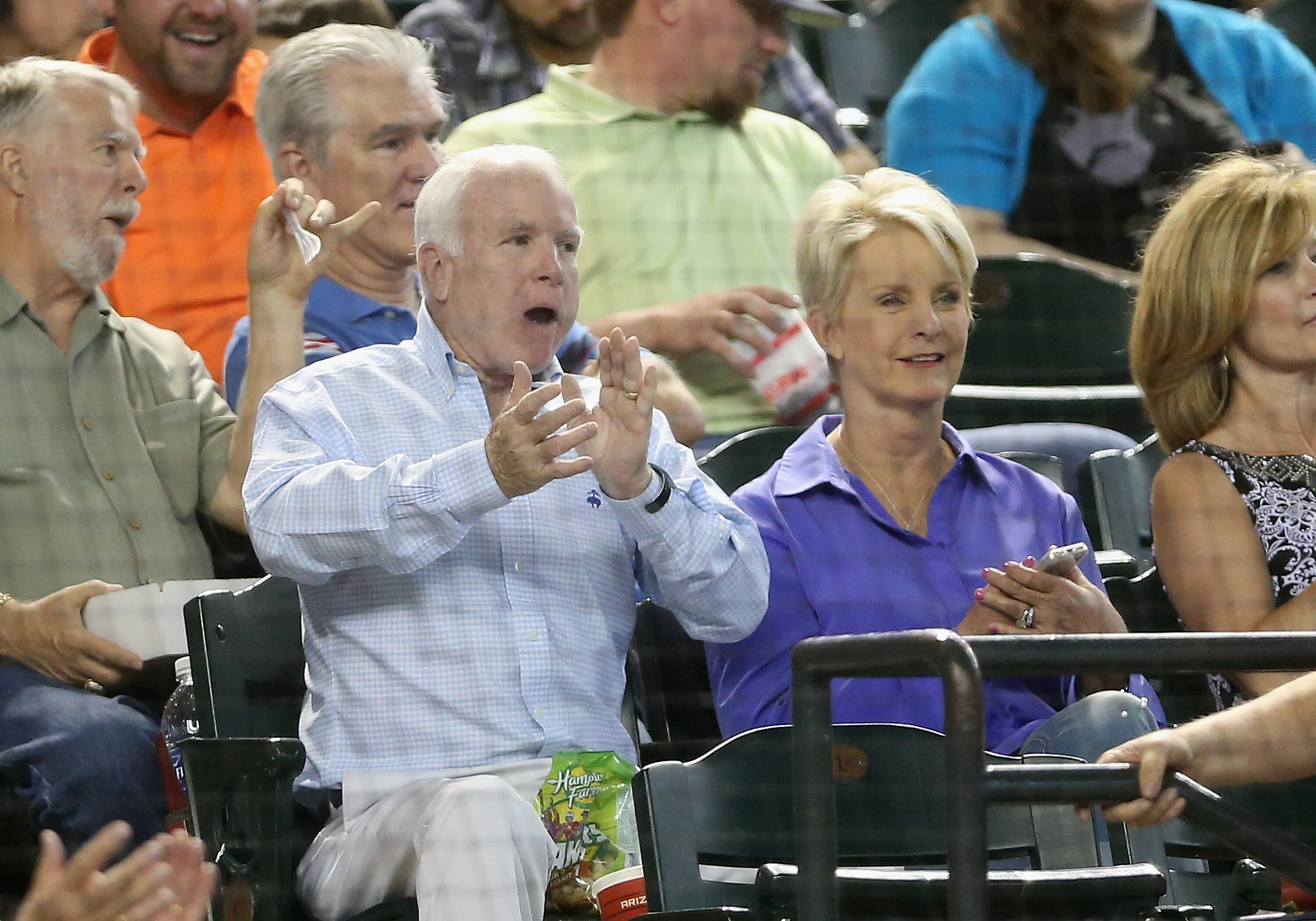 PHOENIX, AZ - MAY 17:  U.S. Senator John McCain (R-AZ) and wife Cindy attend the MLB game between the Arizona Diamondbacks and the Los Angeles Dodgers at Chase Field on May 17, 2014 in Phoenix, Arizona.  (Photo by Christian Petersen/Getty Images)