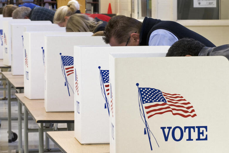 Voters cast their ballots on Election Day November 04, 2008, at Centreville High School in Clifton, Virginia. Americans crowded polling stations Tuesday to vote in their historic election, with front-running Democrat Barack Obama seeking to become the fir