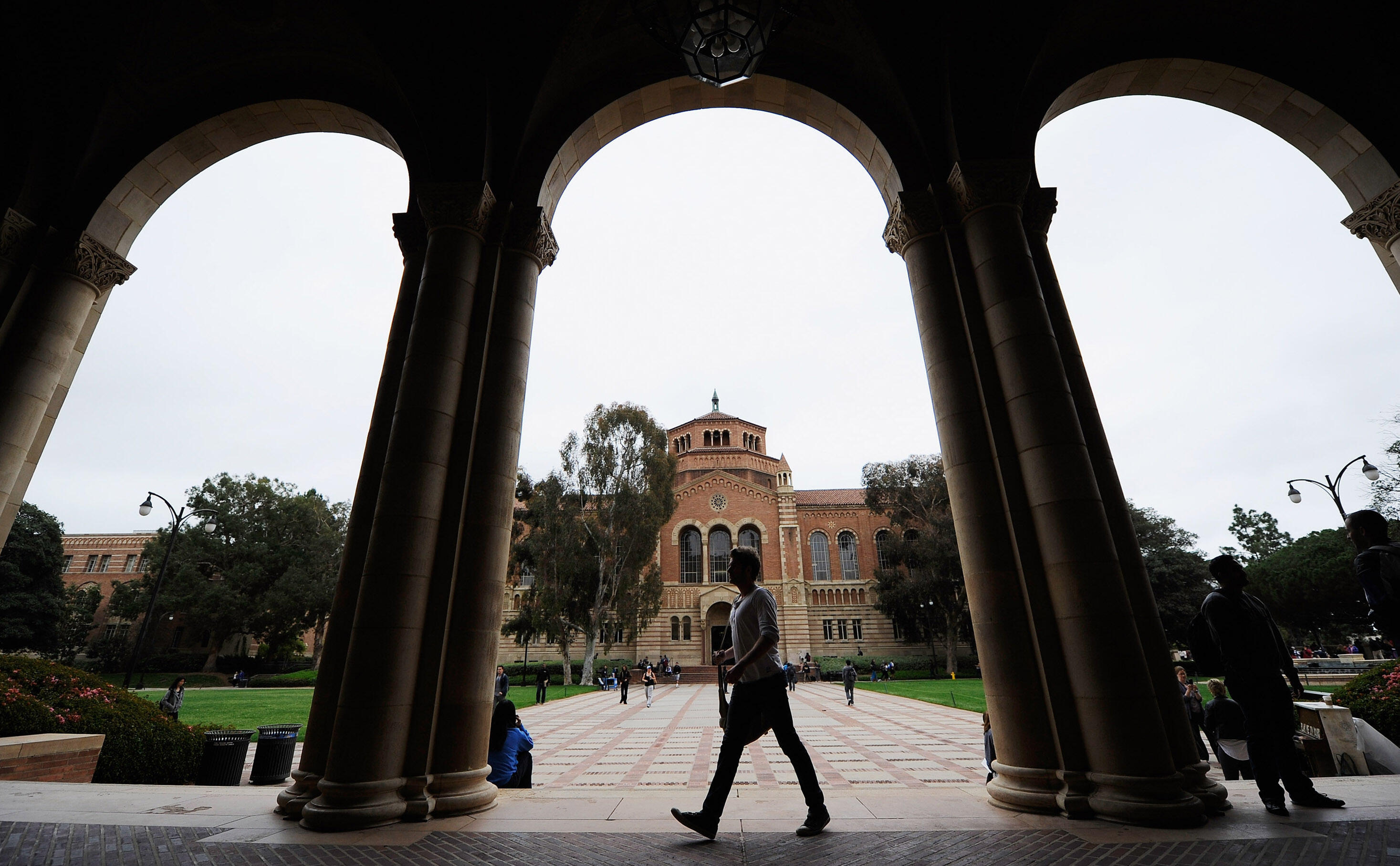 LOS ANGELES, CA - APRIL 23:  A student walks near Royce Hall on the campus of UCLA on April 23, 2012 in Los Angeles, California. According to reports, half of recent college graduates with bachelor's degrees are finding themselves underemployed or jobless