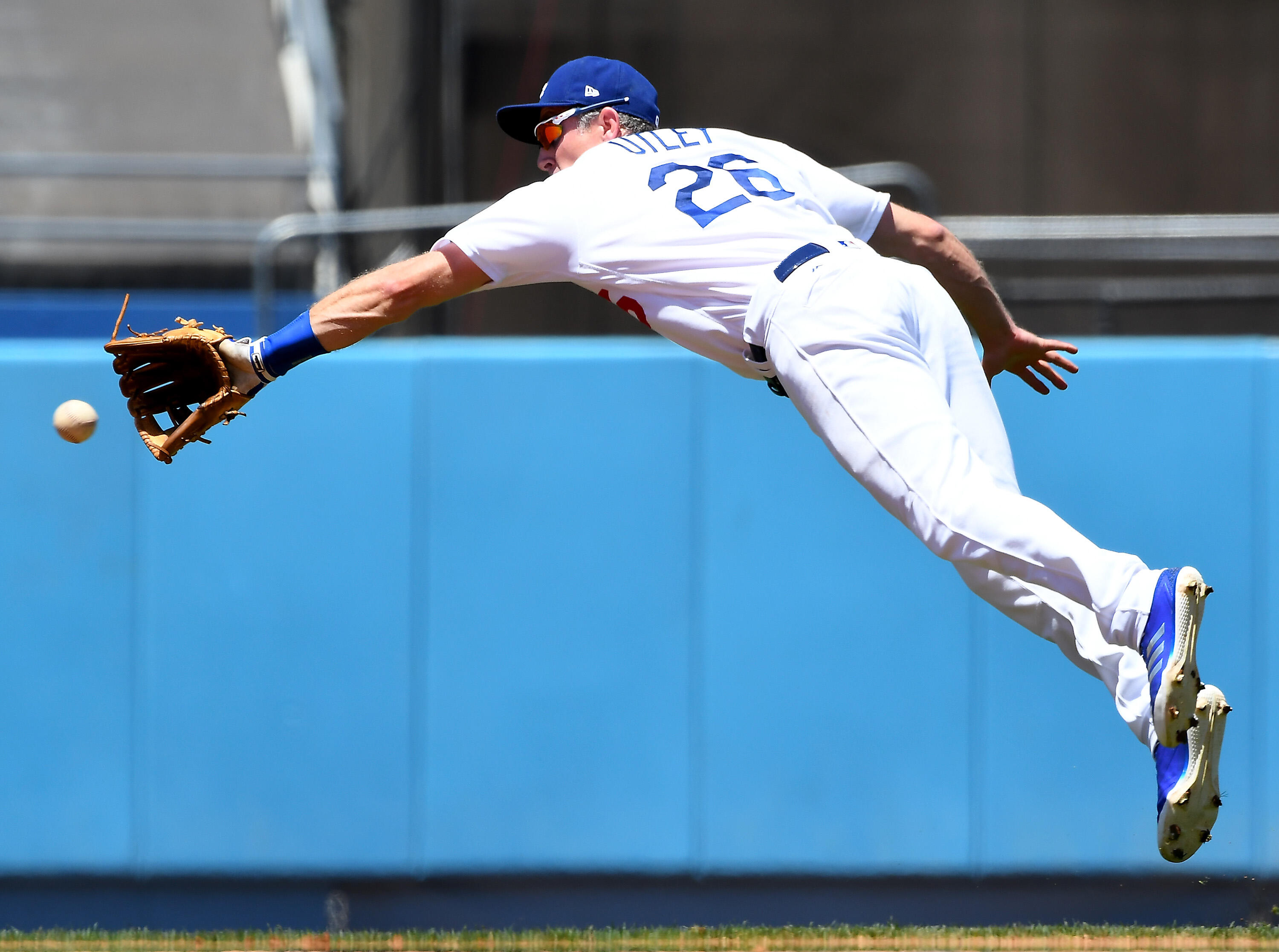 LOS ANGELES, CA - MAY 21:  Chase Utley #26 of the Los Angeles Dodgers dives for a ball getting J.T. Realmuto #11 of the Miami Marlins out in the second inning at Dodger Stadium on May 21, 2017 in Los Angeles, California. (Photo by Jayne Kamin-Oncea/Getty 