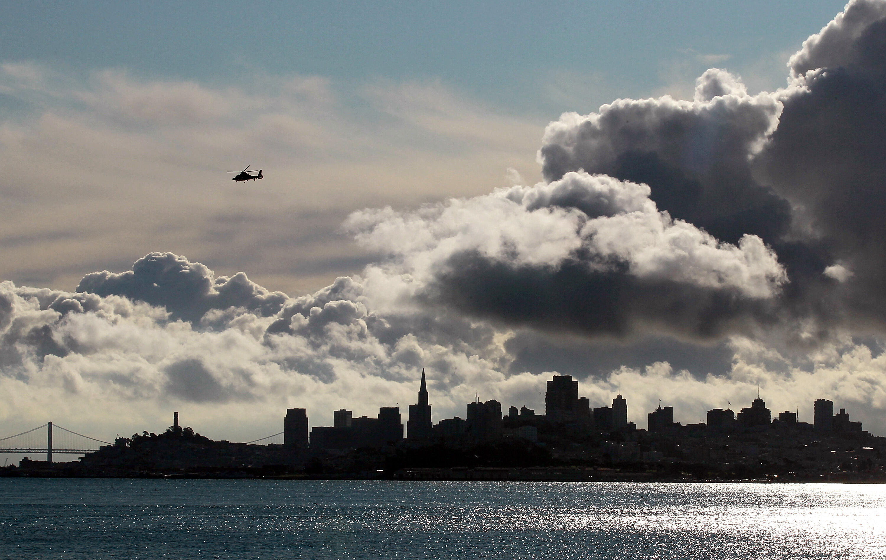 SAUSALITO, CA - NOVEMBER 04:  Clouds pass over the San Francisco skyline on November 4, 2011 in Sausalito, California. The San Francisco Bay Area will see mostly cloudy skies that will lead to a chance of showers in the afternoon. Daytime highs will reach