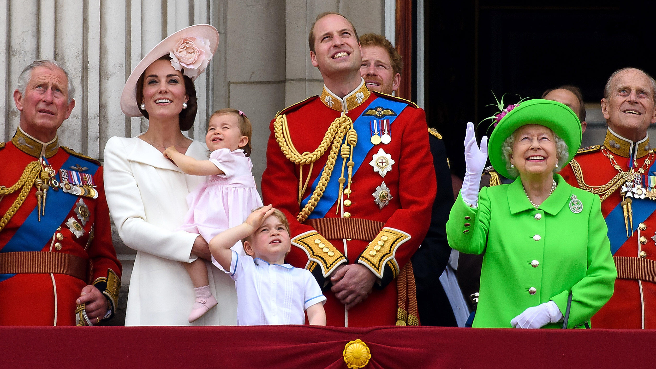 LONDON, ENGLAND - JUNE 11:  (L-R) Prince Charles, Prince of Wales, Catherine, Duchess of Cambridge, Princess Charlotte, Prince George, Prince William, Duke of Cambridge, Prince Harry, Queen Elizabeth II and Prince Philip, Duke of Edinburgh stand on the ba