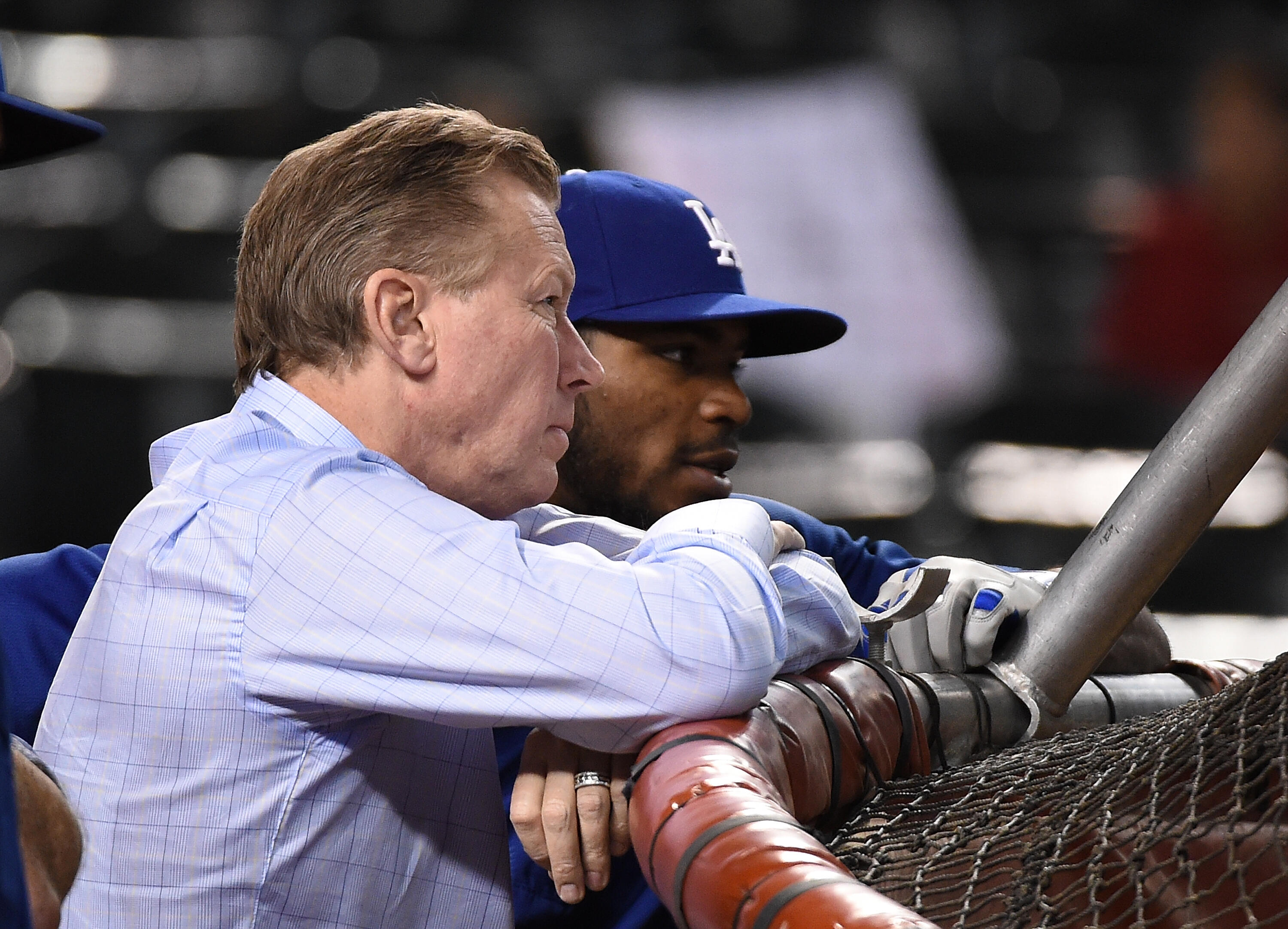PHOENIX, AZ - APRIL 22:  Former Dodgers player Orel Hershiser talks with Yasiel Puig #66 of the Los Angeles Dodgers during batting practice prior to a game against the Arizona Diamondbacks at Chase Field on April 22, 2017 in Phoenix, Arizona.  (Photo by N