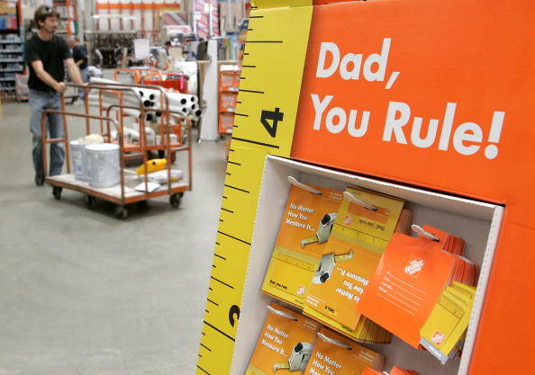 SAN RAFAEL, CA - JUNE 15: A Home Depot customer walks by a display of Father's Day gift cards at a Home Depot store on June 15, 2006 in San Rafael, California. Retail outlets are promoting Father's day gift buying in hopes that the holiday will become mor