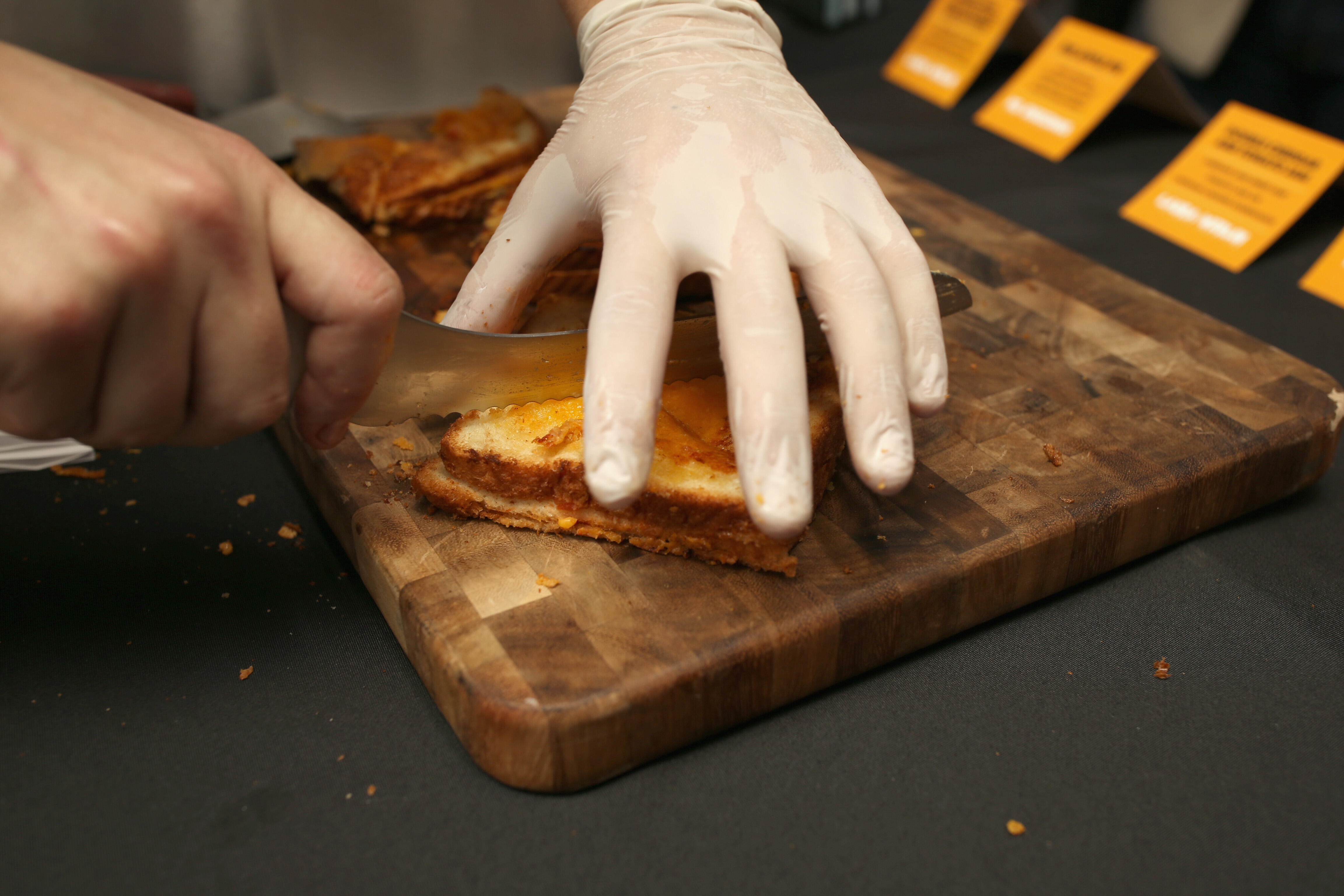 MIAMI BEACH, FL - FEBRUARY 26: Chef prepares food at the Grilled Cheese Happy Hour Hosted By Laura Werlin And Ms. Cheezious during 2016 Food Network & Cooking Channel South Beach Wine & Food Festival Presented By FOOD & WINE at Cibo Wine Bar on February 2