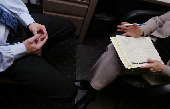 NEW YORK - MAY 7:  A job applicant (L) speaks with recruiter Renee Chandler (R) during an interview May 7, 2003 at the offices of Metro Support Group in New York City.  The nation's jobless rate climbed to six percent in April, rising for the third straig