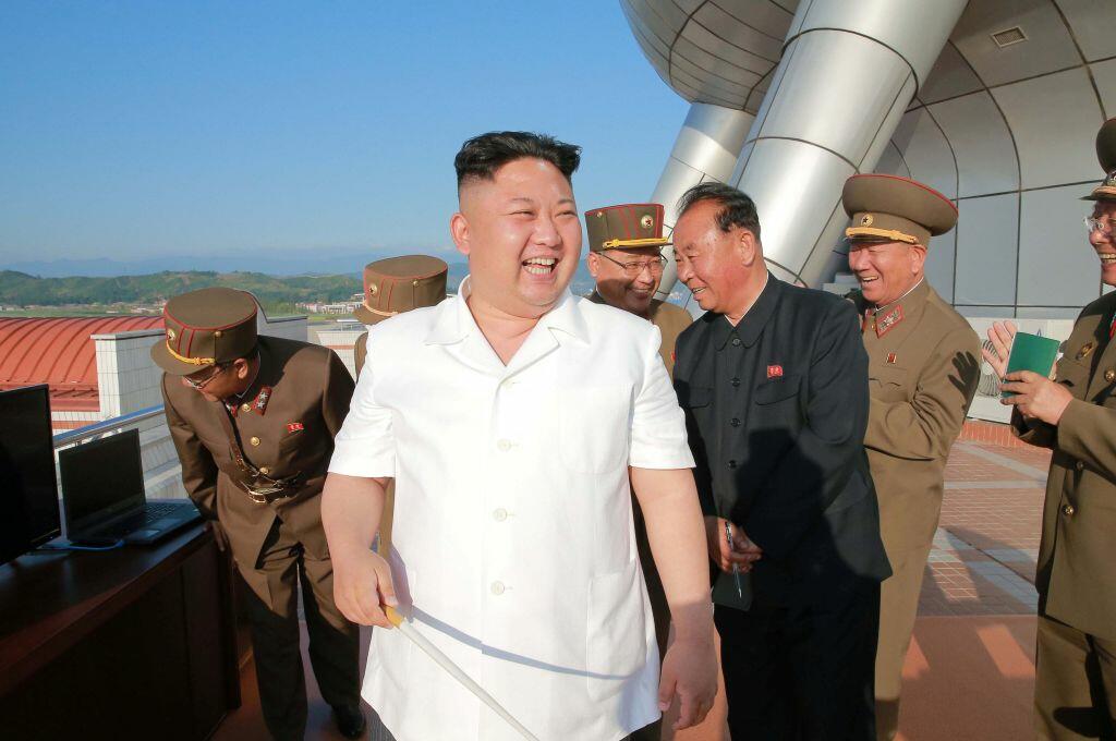 This undated picture released from North Korea's official Korean Central News Agency (KCNA) on June 9, 2017 shows North Korean leader Kim Jong-Un (C) inspecting a test-fire of a new-type ground-to-sea cruise rocket developed by the Academy of National Defence Science at an undisclosed location in North Korea. / AFP PHOTO / KCNA VIA KNS / STR        (Photo credit should read STR/AFP/Getty Images)